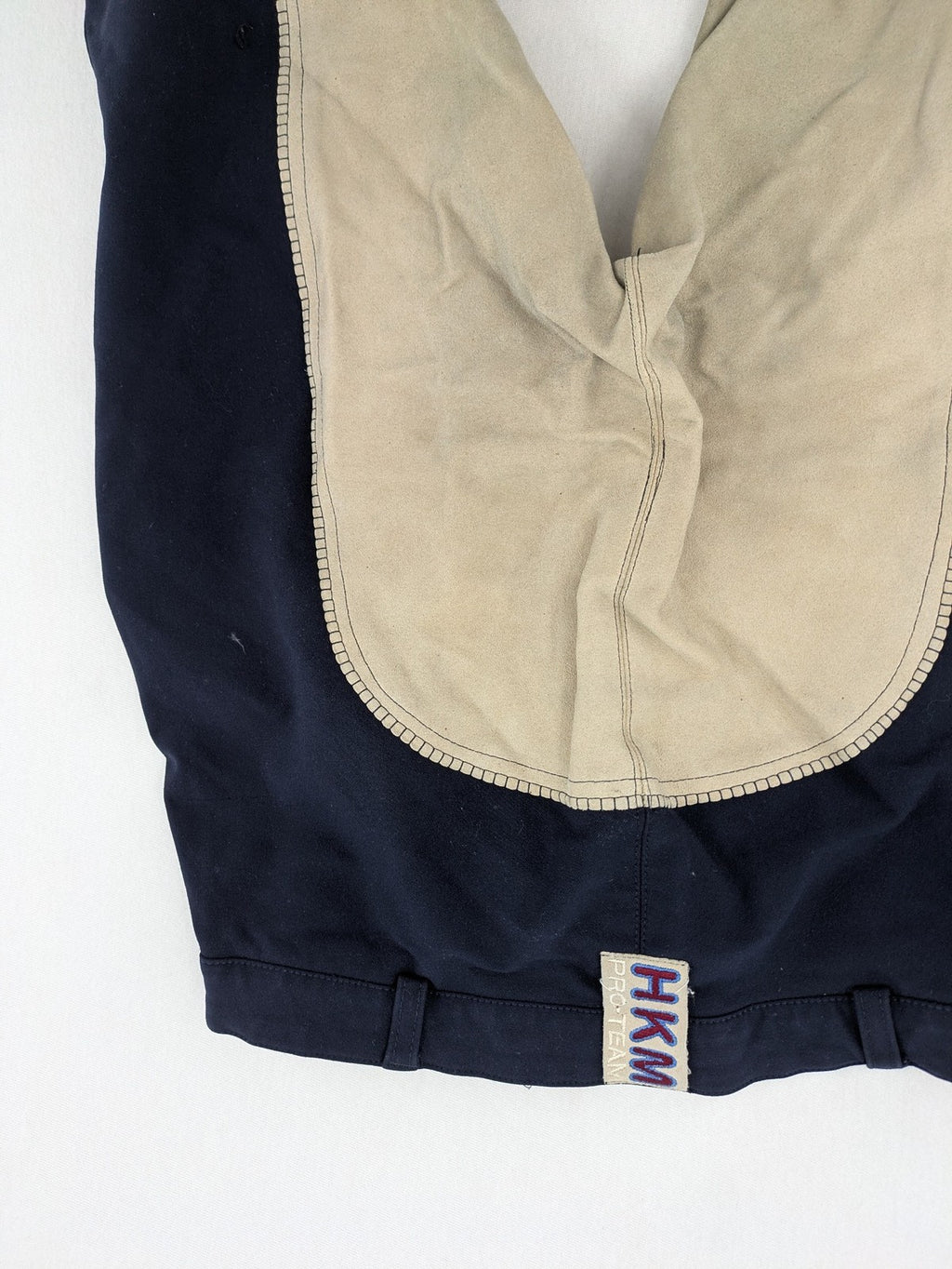 H&KM beige riding pants with dark blue full seat and front zippers.