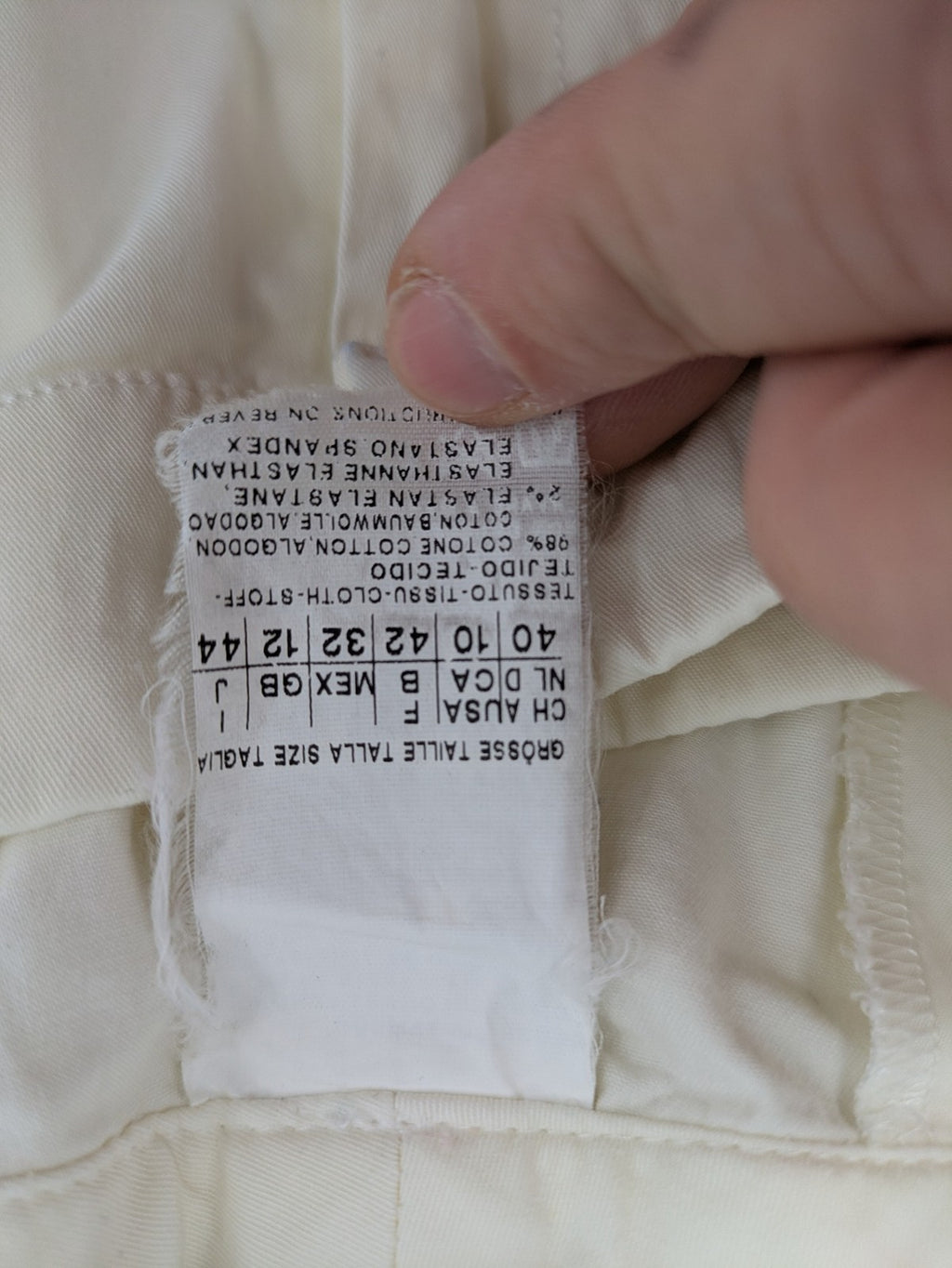 MaxMara cream cropped chino pants with zipper closure, belt loops, and back pockets.