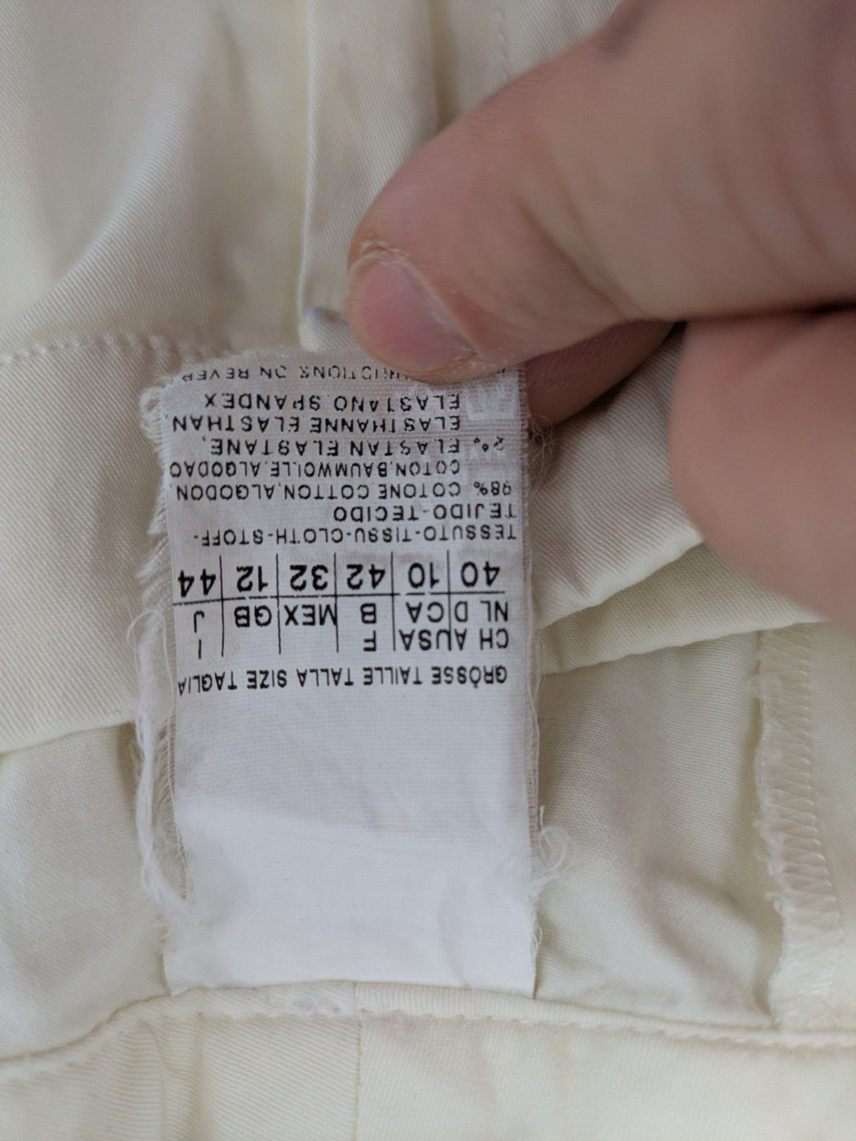 MaxMara cream cropped chino pants with zipper closure, belt loops, and back pockets.