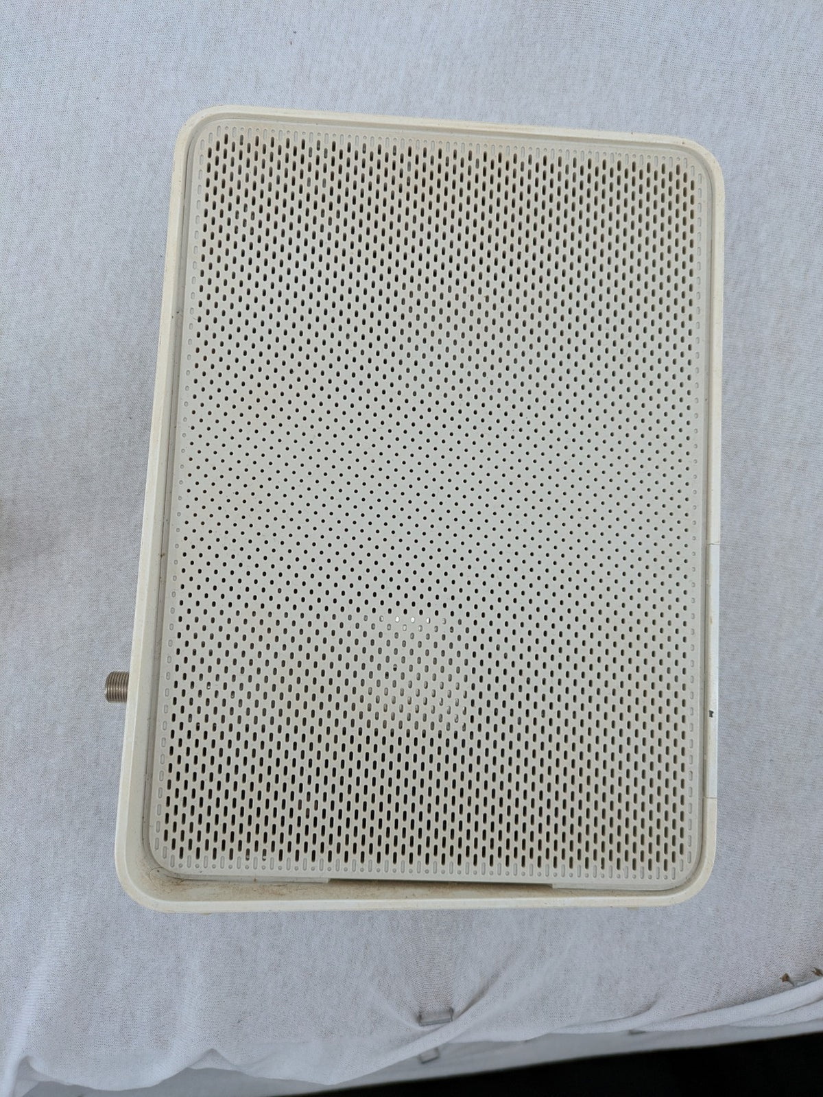 Compal beige WLAN modem router with integrated Wi-Fi and multiple LAN ports.