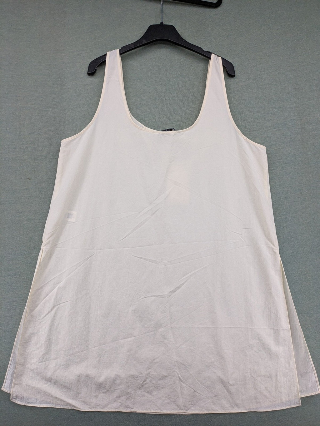 Zara cream tank top, sleeveless design, smooth polyamide fabric, minimalist style.