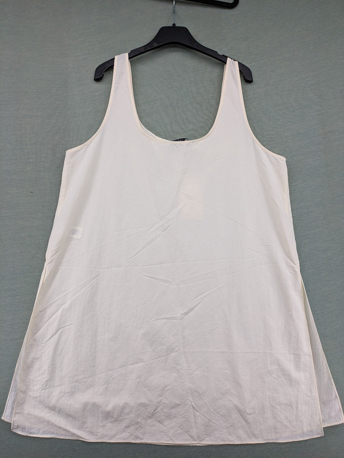 Zara cream tank top, sleeveless design, smooth polyamide fabric, minimalist style.
