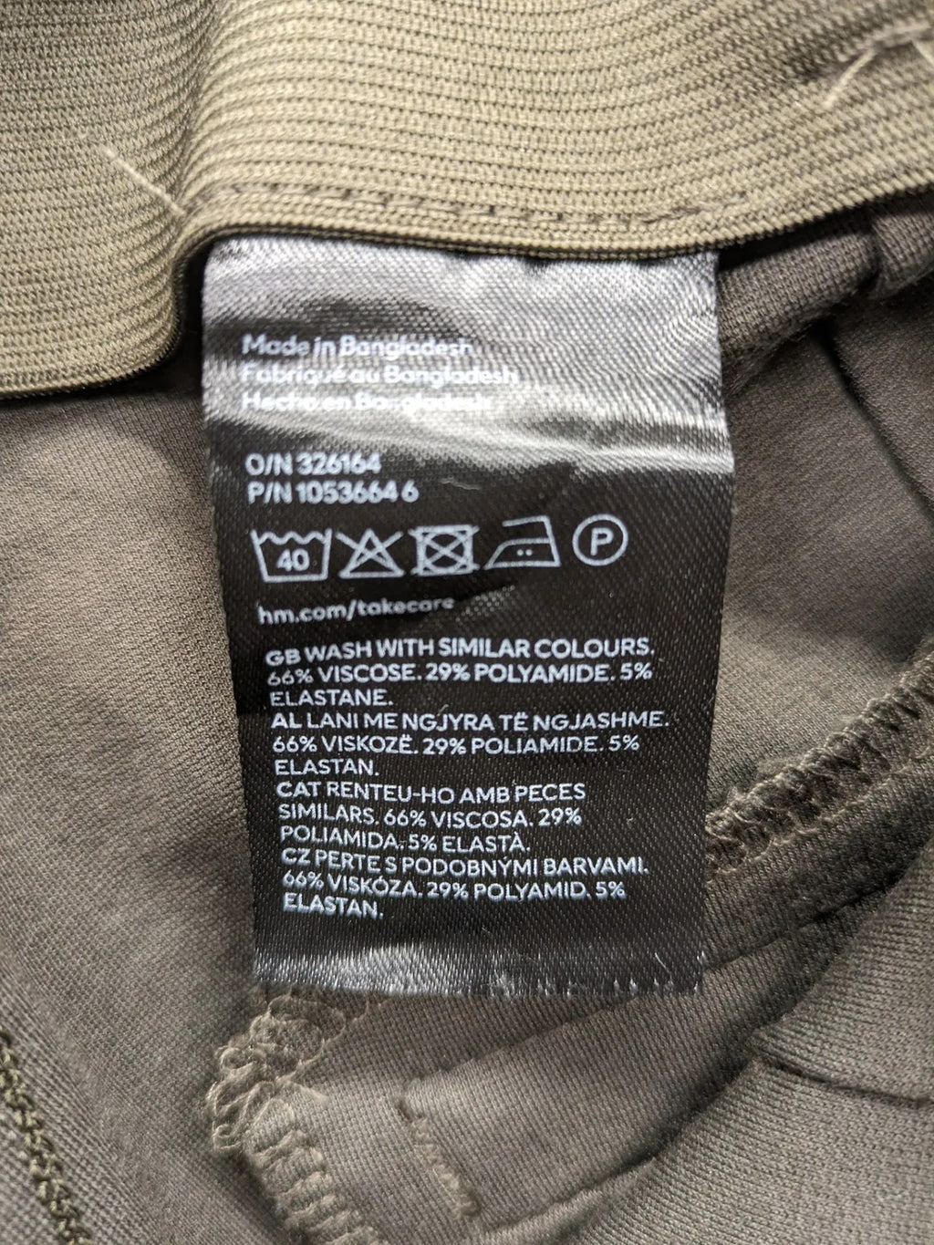 H&M khaki pants with front seam detail and stretchy material for comfort.