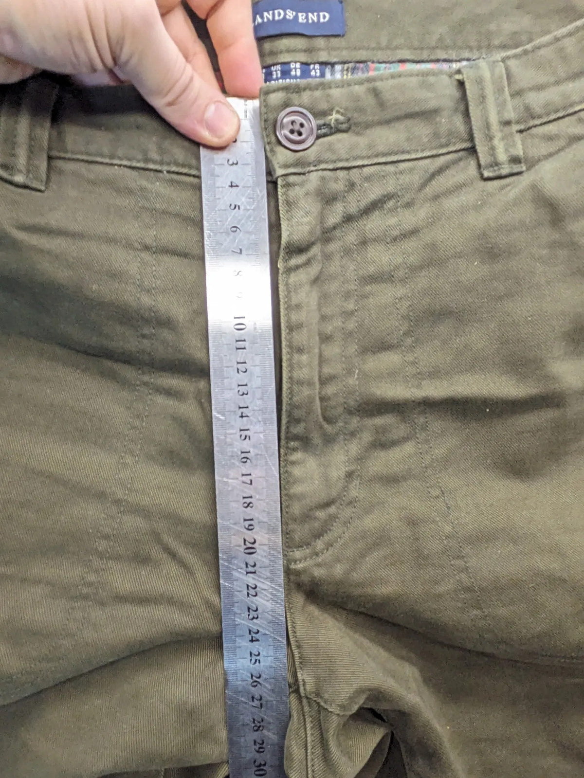Lands' End green cargo pants with plaid flannel lining and traditional fit design.