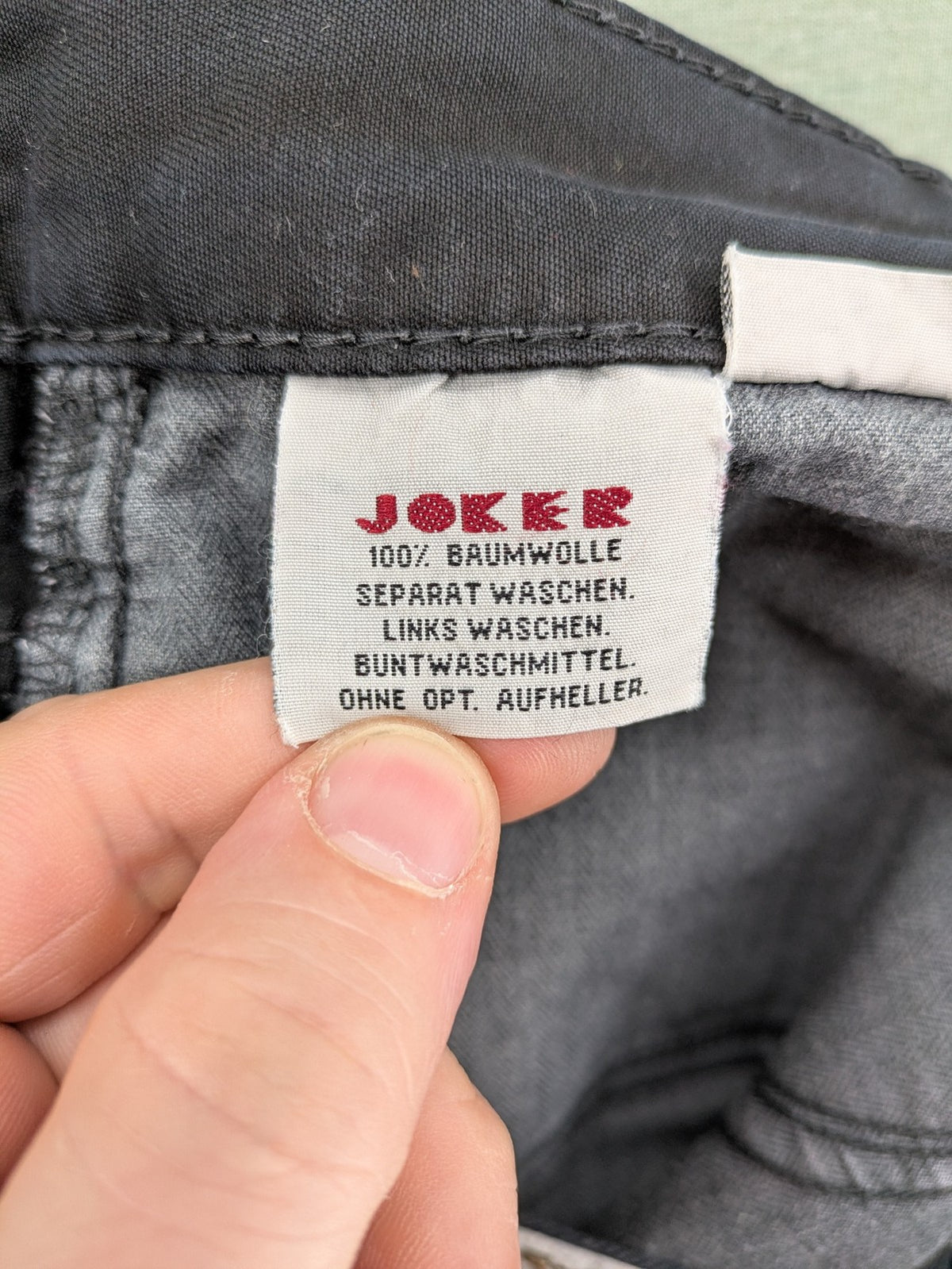 Joker black straight jeans five-pocket design with prominent stitching and brand details.