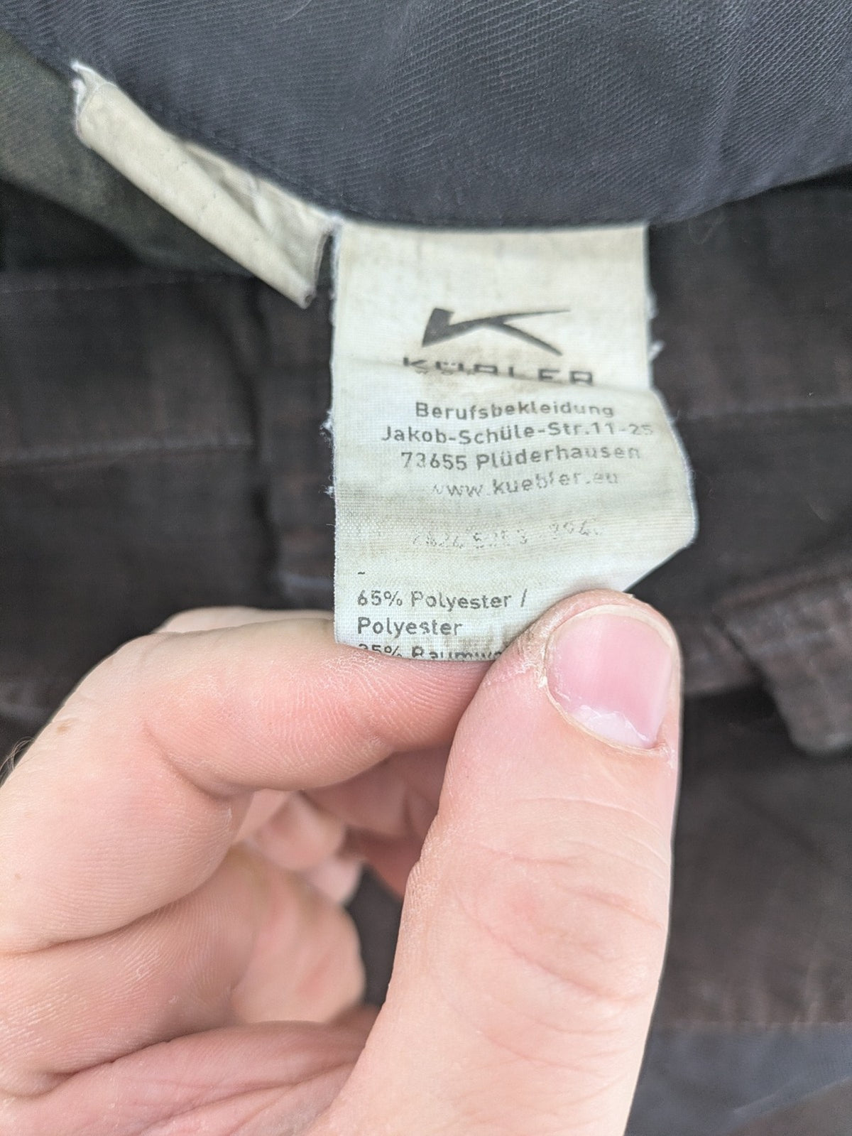 Kübler work pants blue grey Cordura fabric with multiple cargo pockets and reflective details.