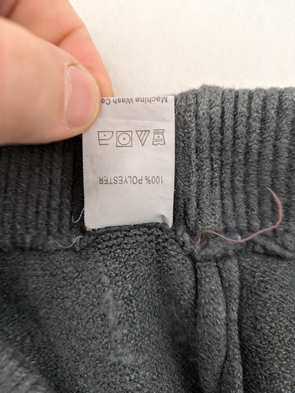 Grey pants with cable knit pattern, wide leg, ribbed waistband, 100% polyester.