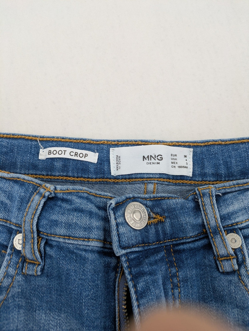 MNG blue straight jeans with kick-flare leg and raw hem, made of cotton blend.