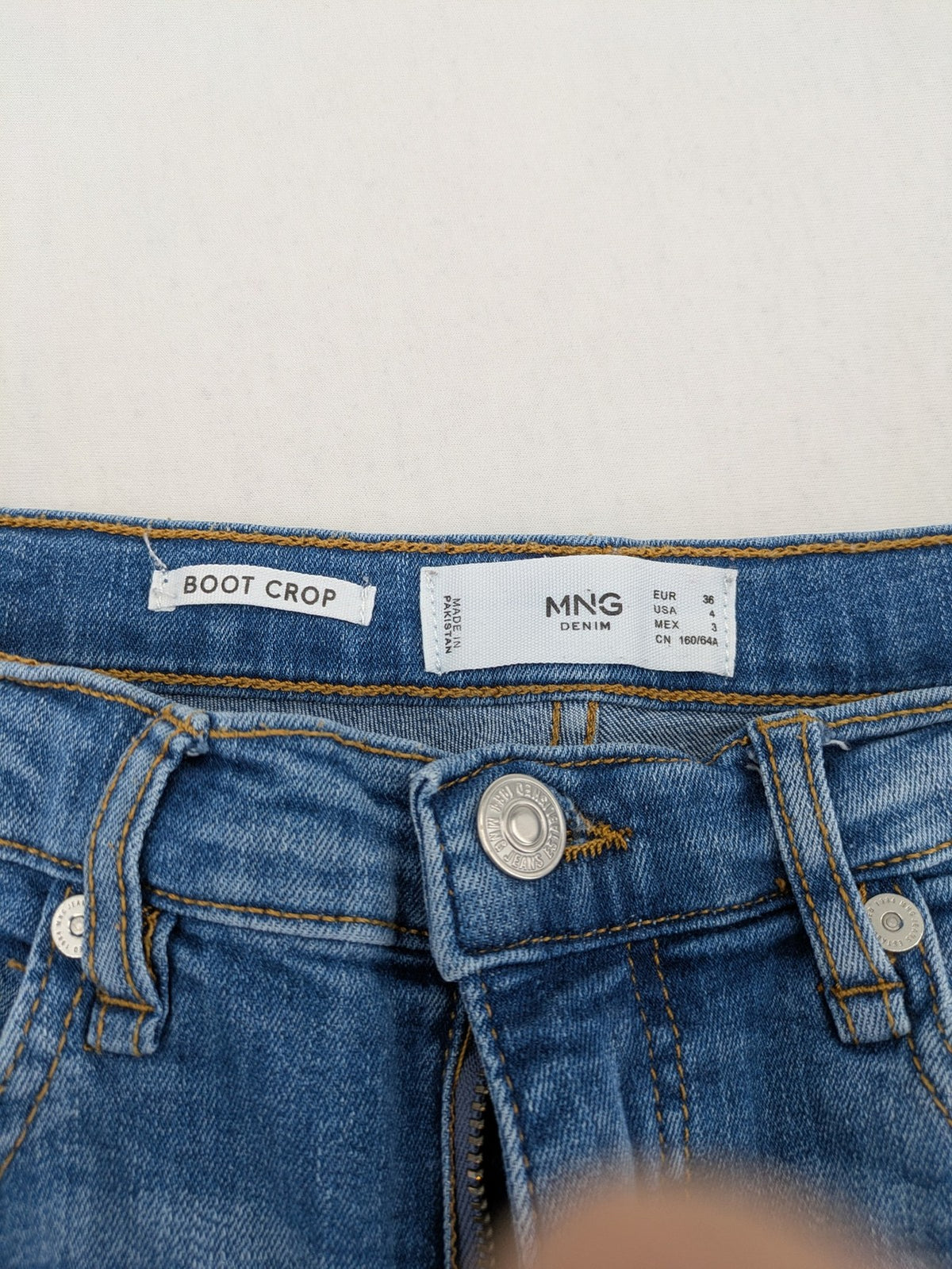 MNG blue straight jeans with kick-flare leg and raw hem, made of cotton blend.