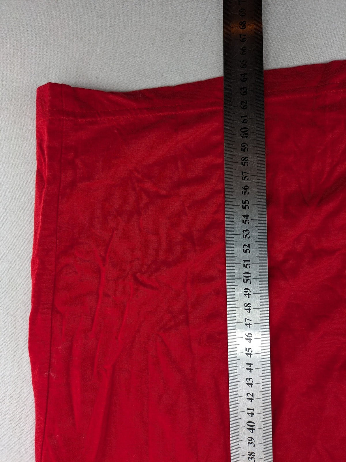 ck red Ringer T-shirt with white collar, "Aufregend.gut" slogan, 100% cotton.