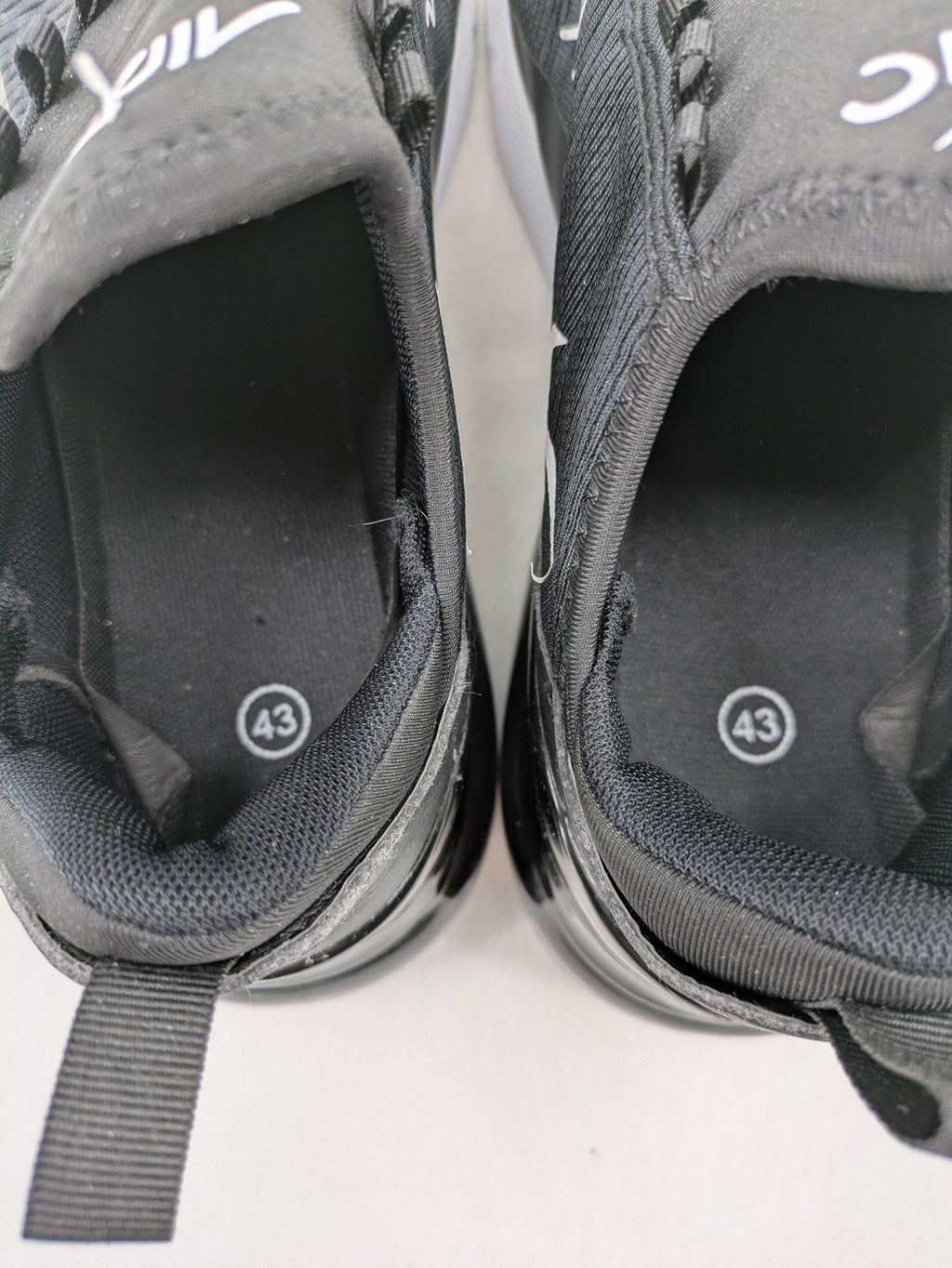 Nike Air Max 270 black and grey sneakers with large Air unit and white accents