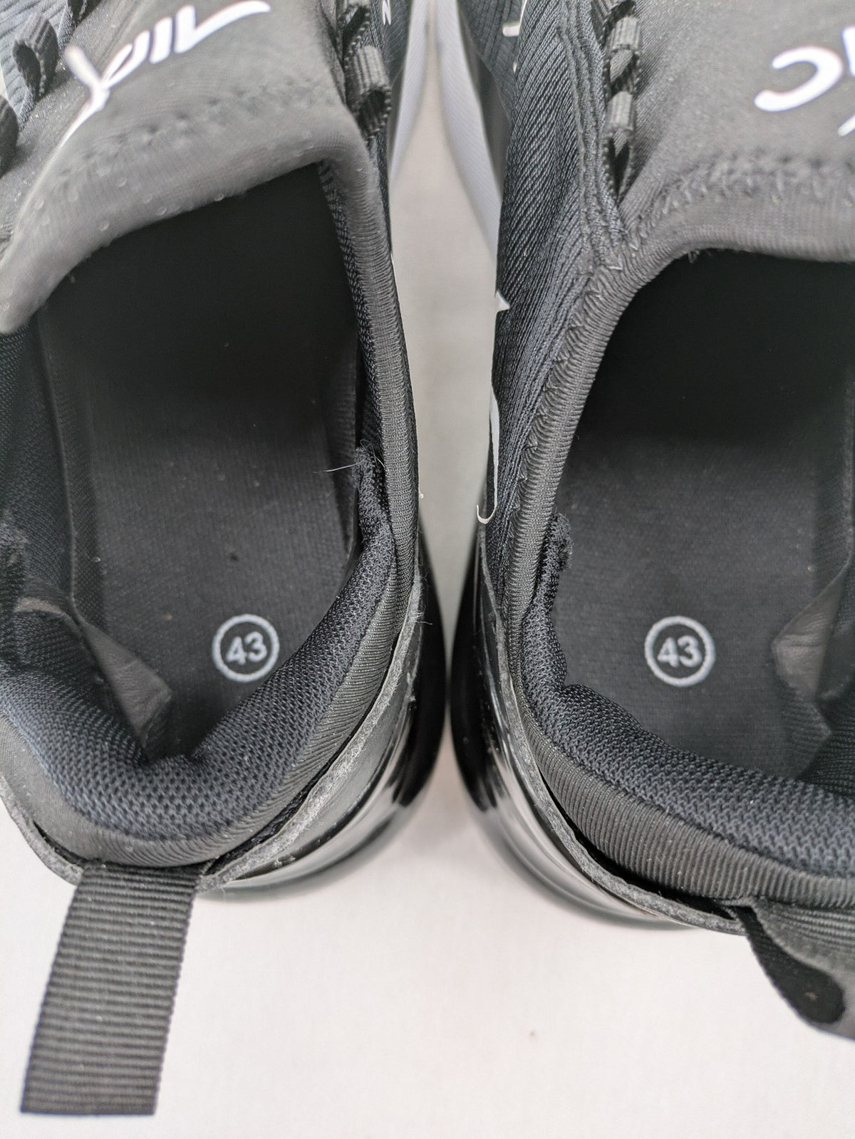 Nike Air Max 270 black and grey sneakers with large Air unit and white accents