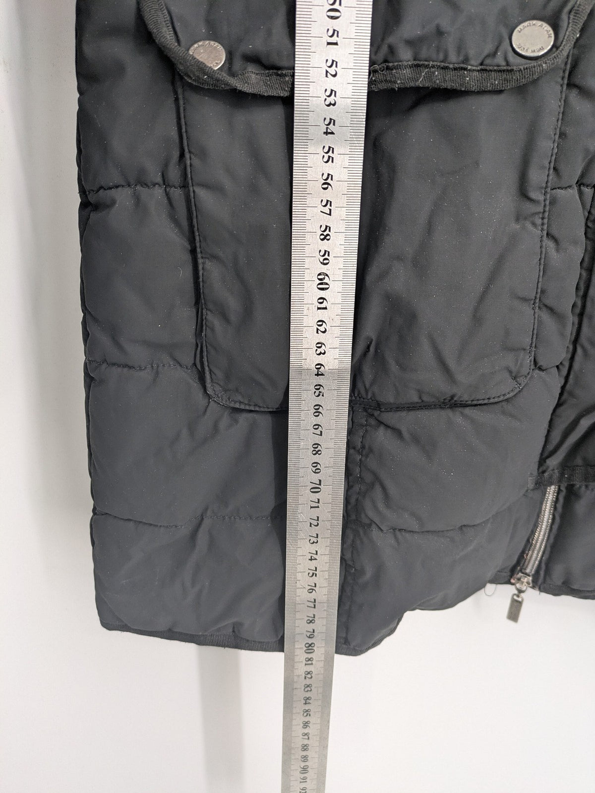 Mark Adam grey quilted jacket with high collar and buttoned flap pockets.