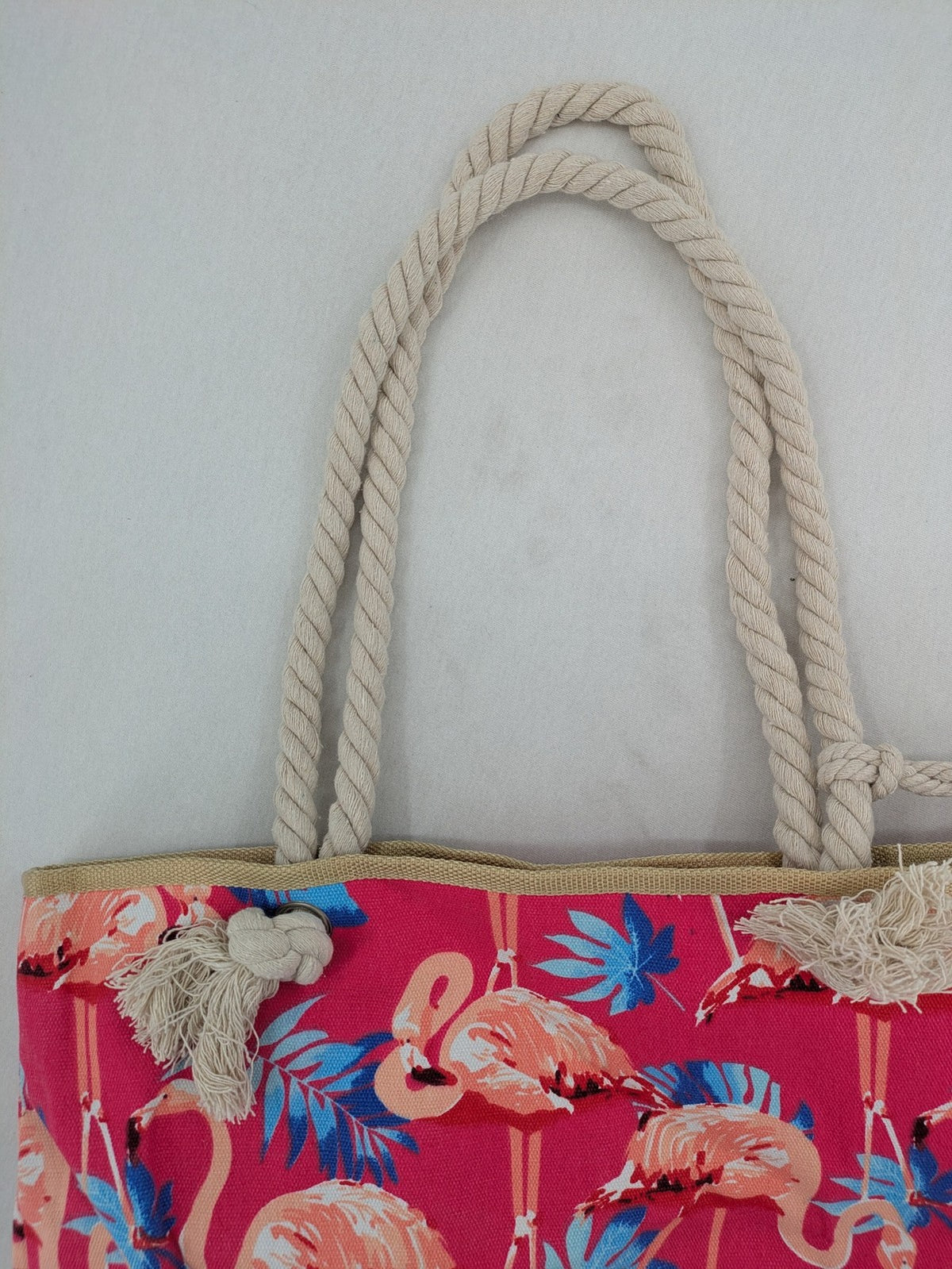 Flamingo pink shopping tote with vibrant tropical flamingo and palm leaf pattern.