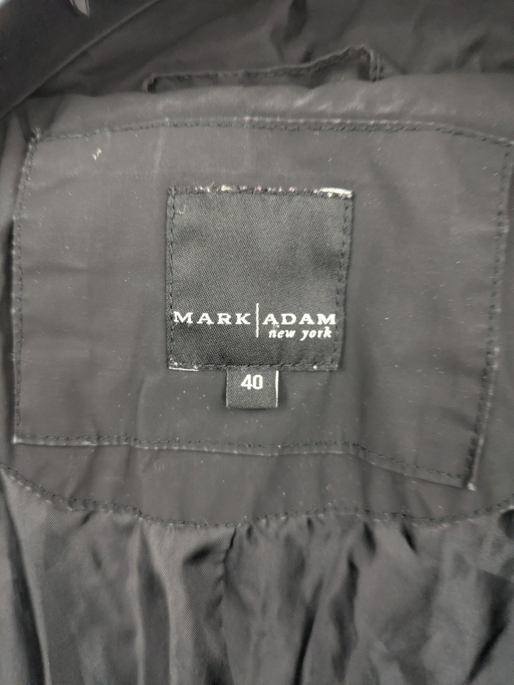 Mark Adam grey quilted jacket with high collar and buttoned flap pockets.