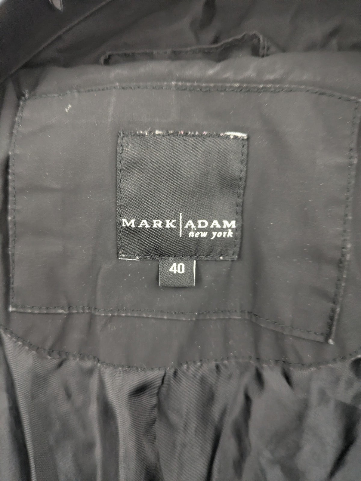 Mark Adam grey quilted jacket with high collar and buttoned flap pockets.