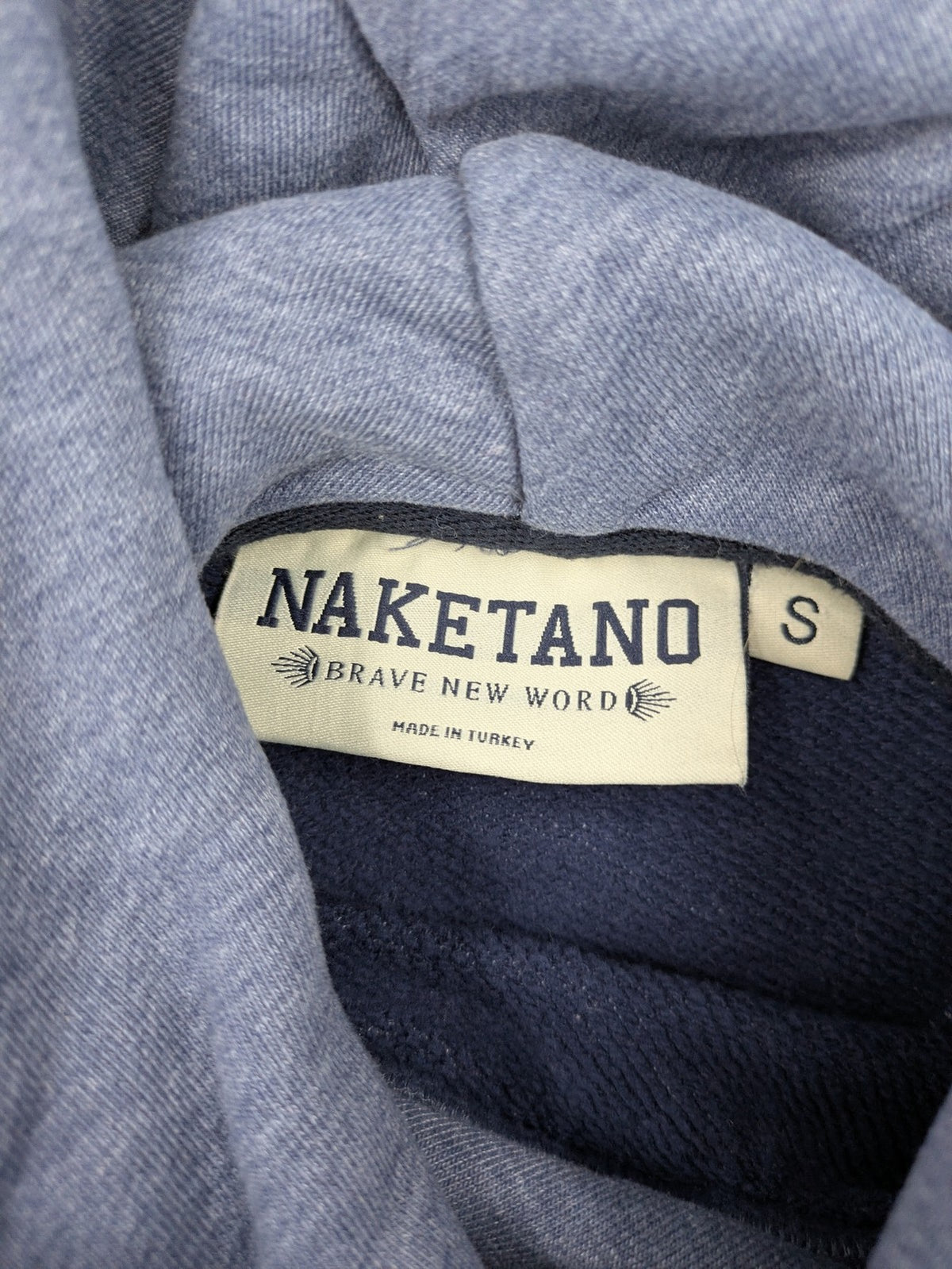 Naketano multi turtle neck jumper colorblock design in blue, pink, and grey.