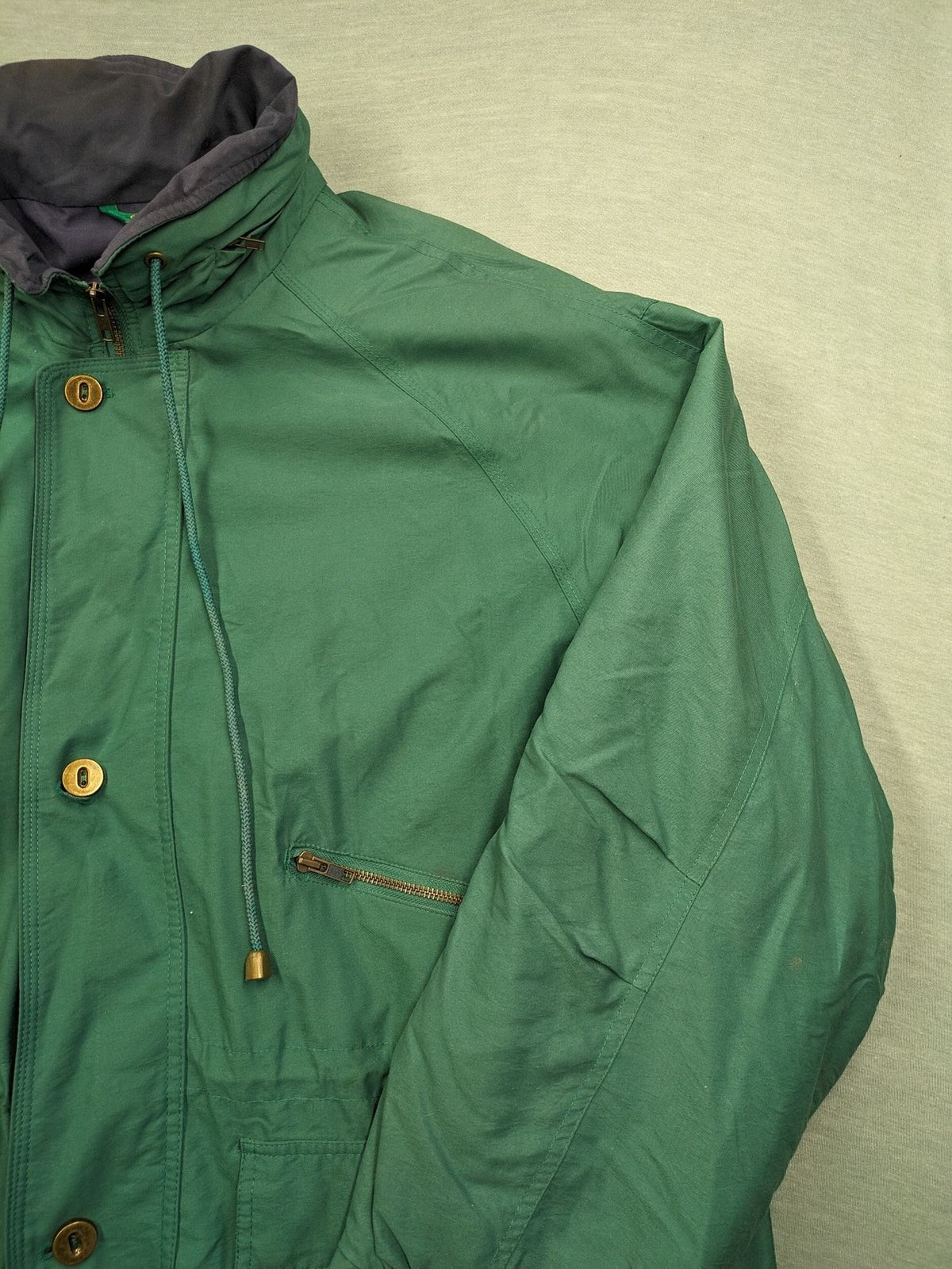 Canda green parka coat with dark lining, multiple pockets, and Micro Membrane technology.