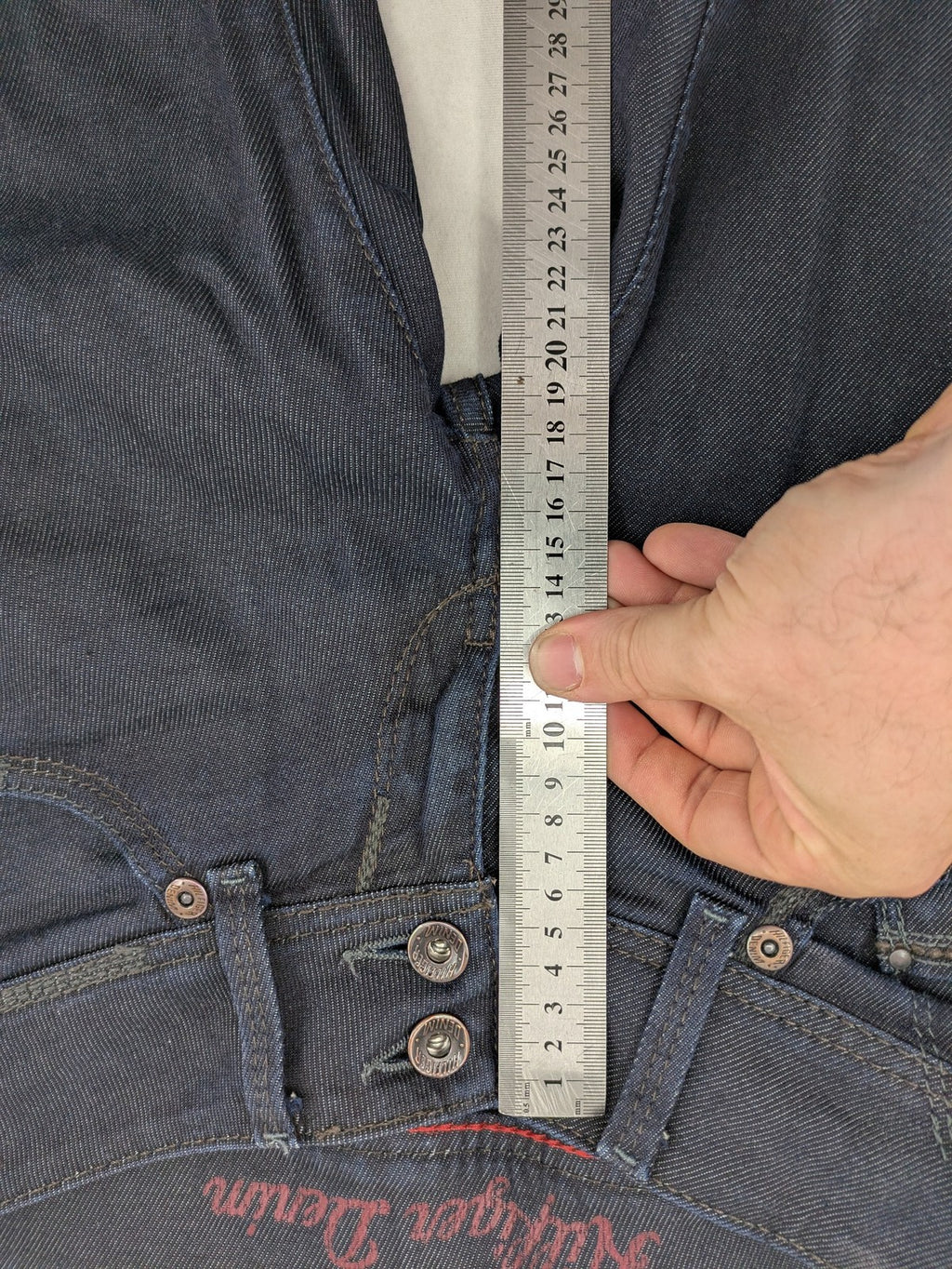 Hilfiger Denim blue straight jeans with double button closure and logo detail.