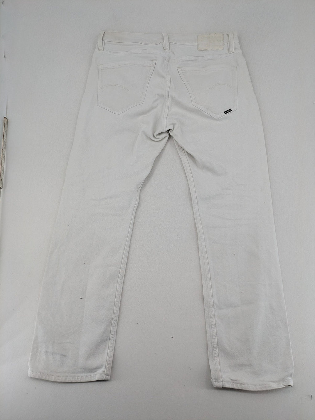 G-Star Raw white straight jeans with logo patch and stretch denim material.
