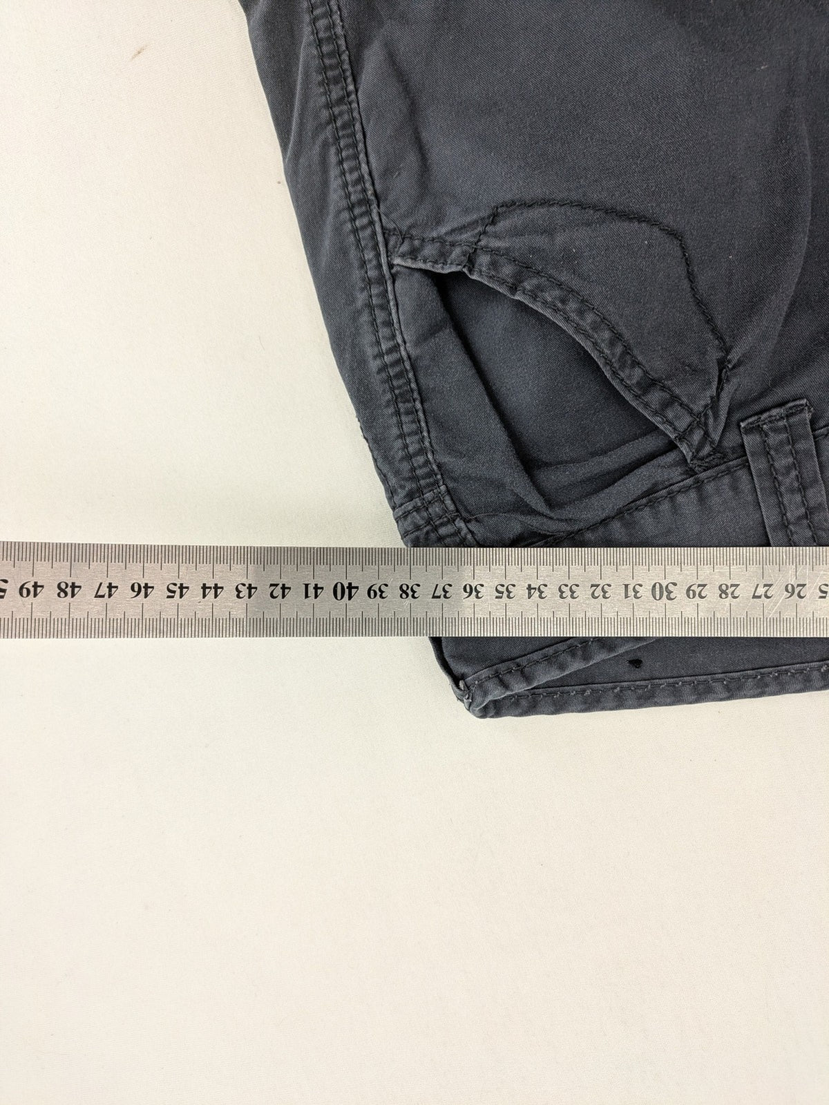 Crosswind grey cargo shorts with multiple pockets and durable cotton material.