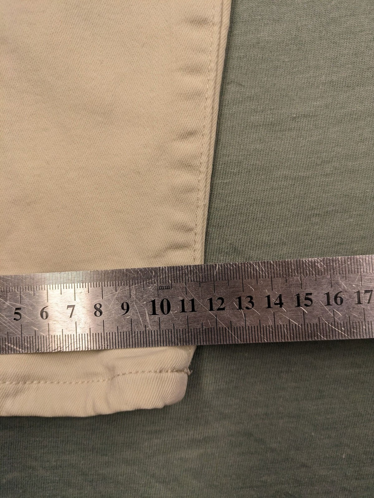 Tommy Jeans beige high rise skinny ankle jeans with logo patch and stretch fabric.