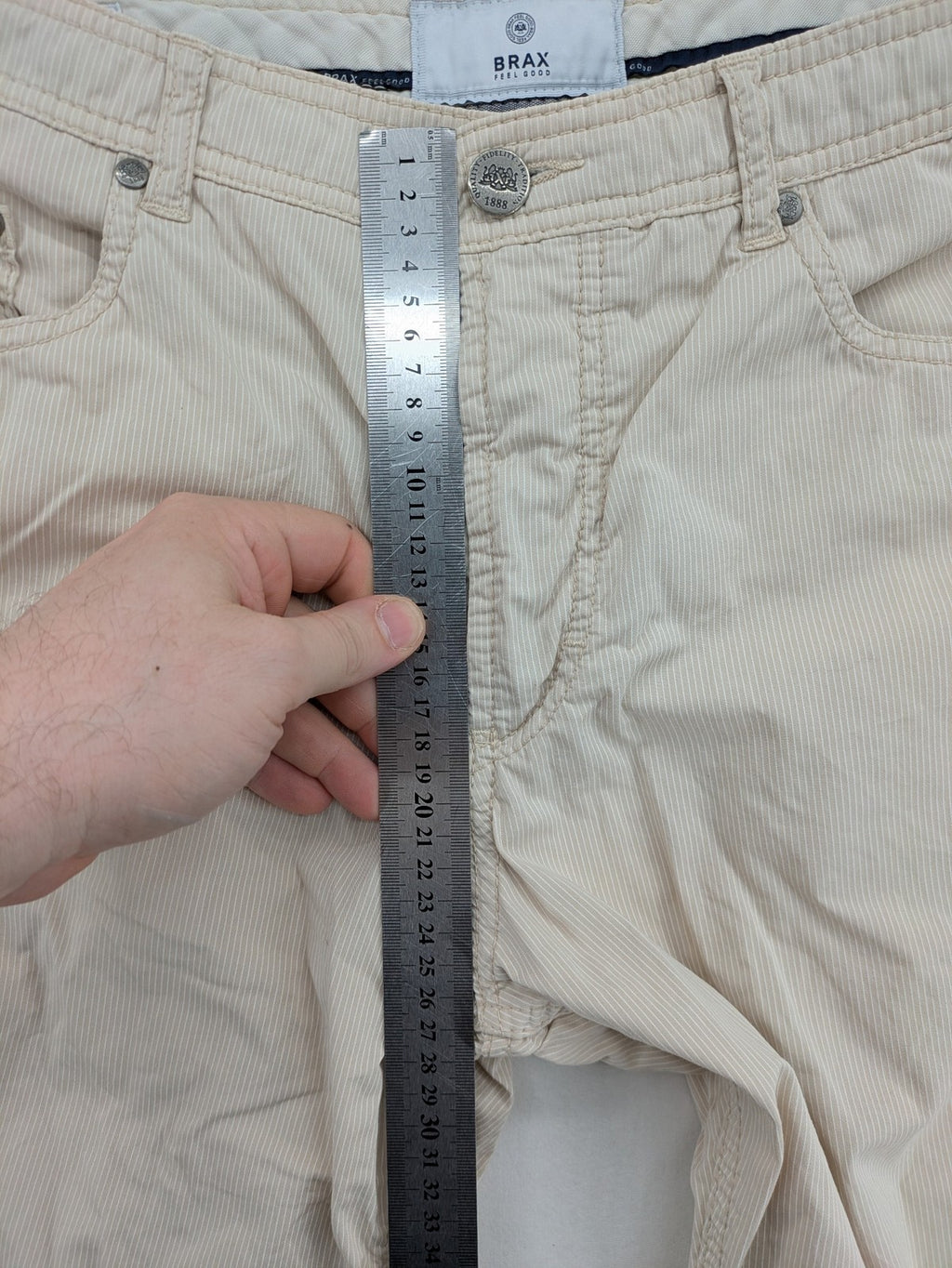 BRAX beige striped pants with logo, made from comfortable stretch cotton blend.