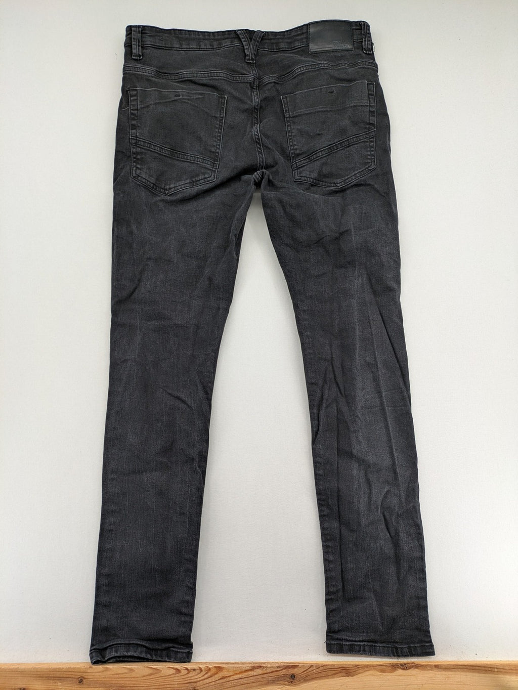 Denim 1982 grey slim fit jeans with ripped knee detail and distressed finish.