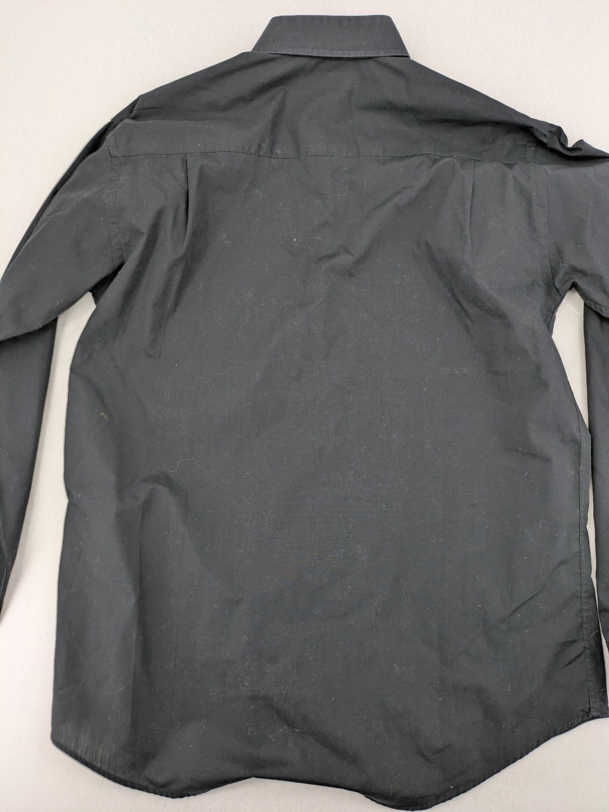 Cedarwood State black long sleeve shirt with classic collar and chest pocket.