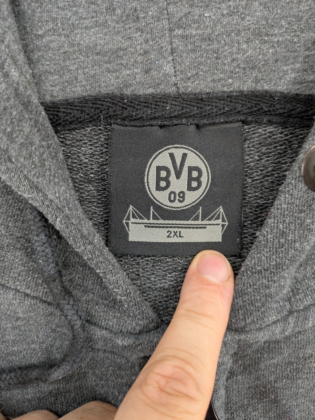 Borussia Dortmund grey and black hoodie with BVB 09 logo and full zip design.
