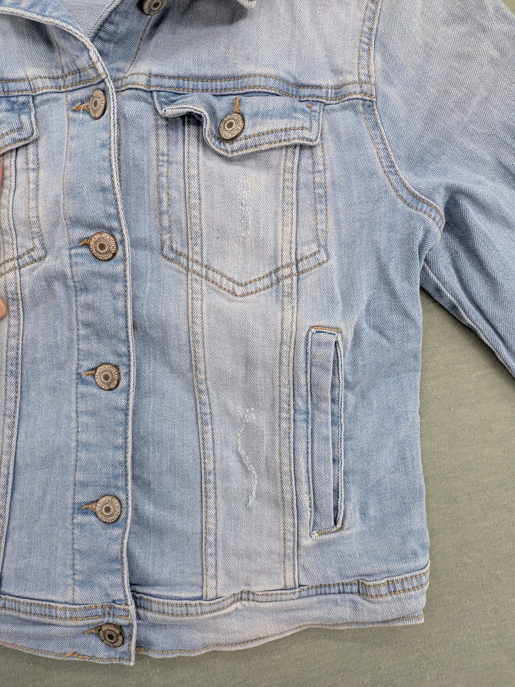 Pimkie blue denim jacket with classic cut, button placket, and two chest pockets.