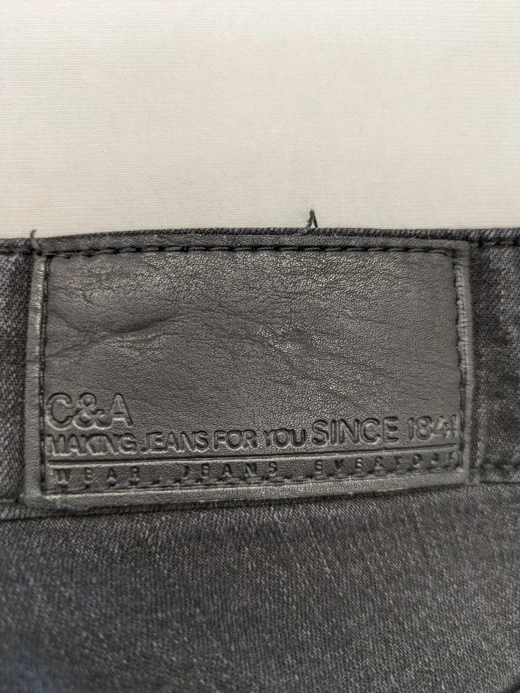 C&A grey straight jeans five-pocket design made from cotton blend with stretch.