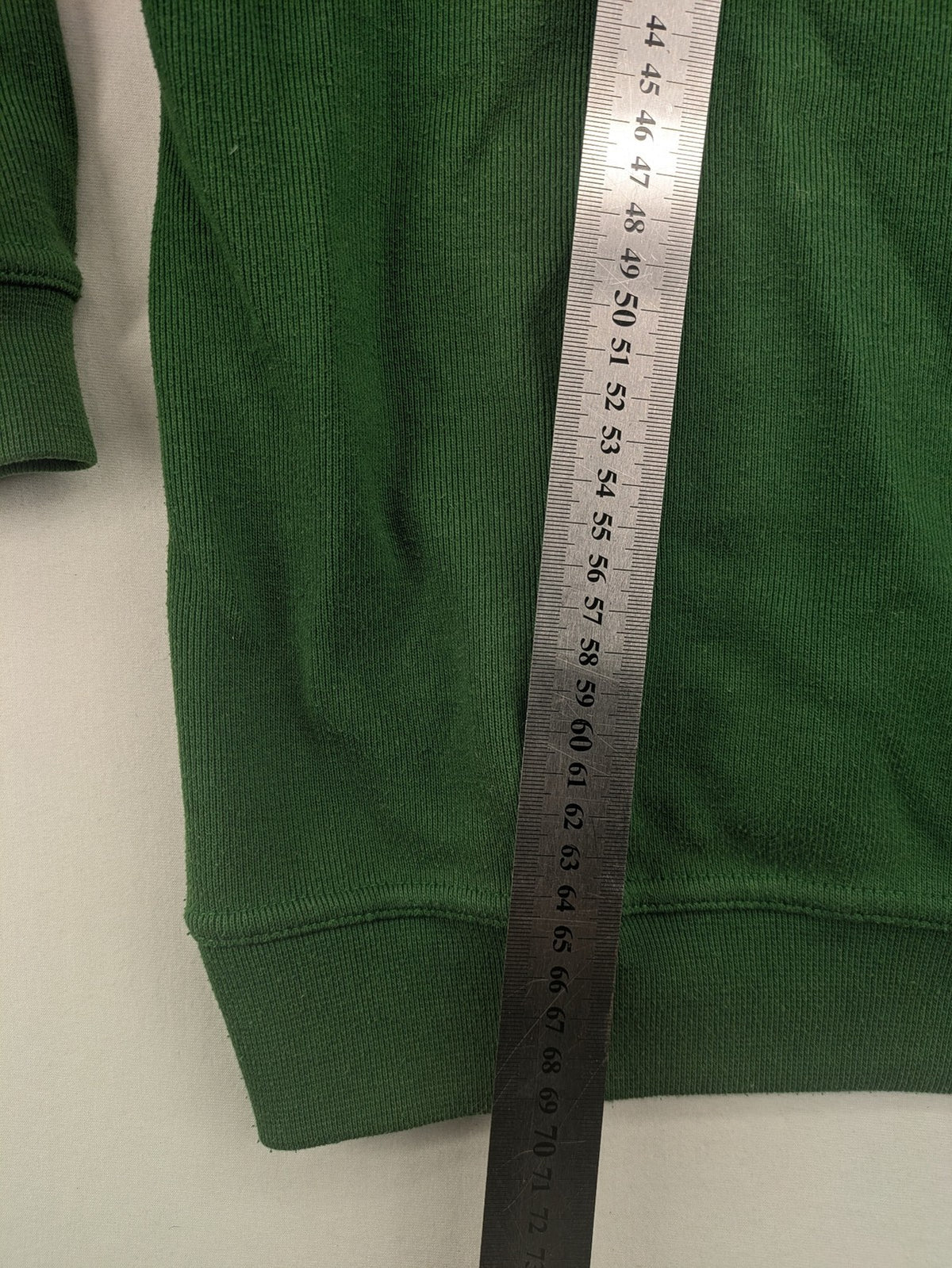 Headlands green turtle neck jumper with gingham collar and "Golden Beach" embroidery.