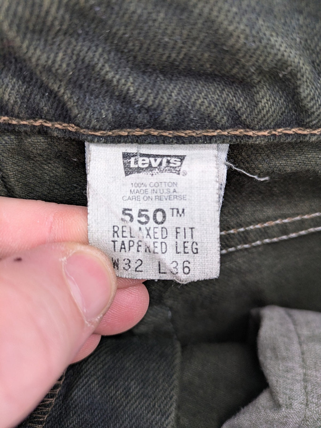 Levi's green 550 relaxed fit tapered jeans, vintage denim, made in USA.