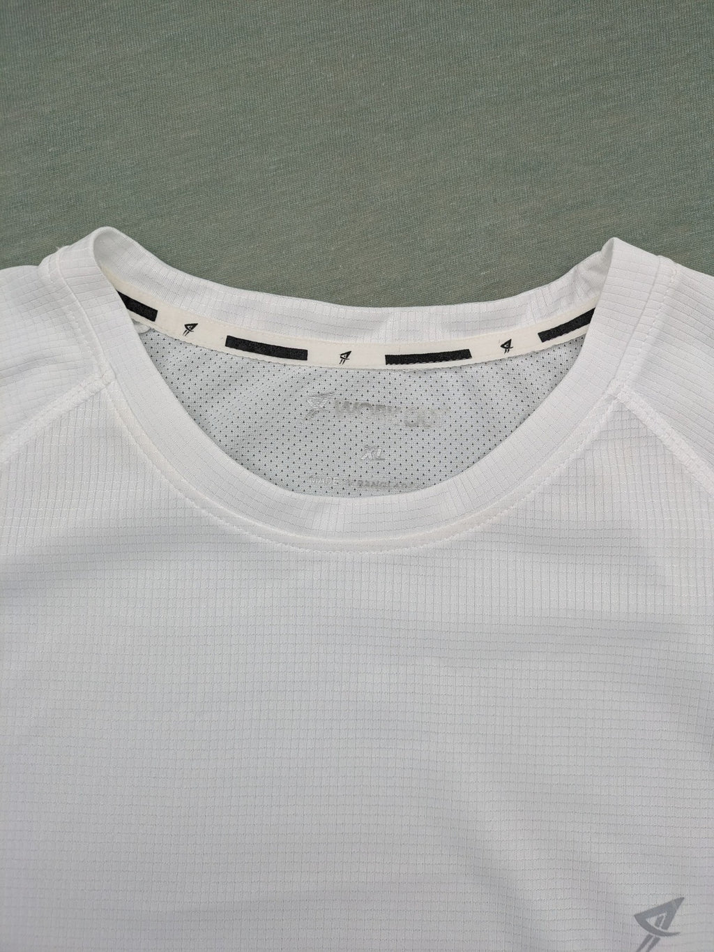 Smilodox white workout t-shirt with logo on chest and reflective detail on back.