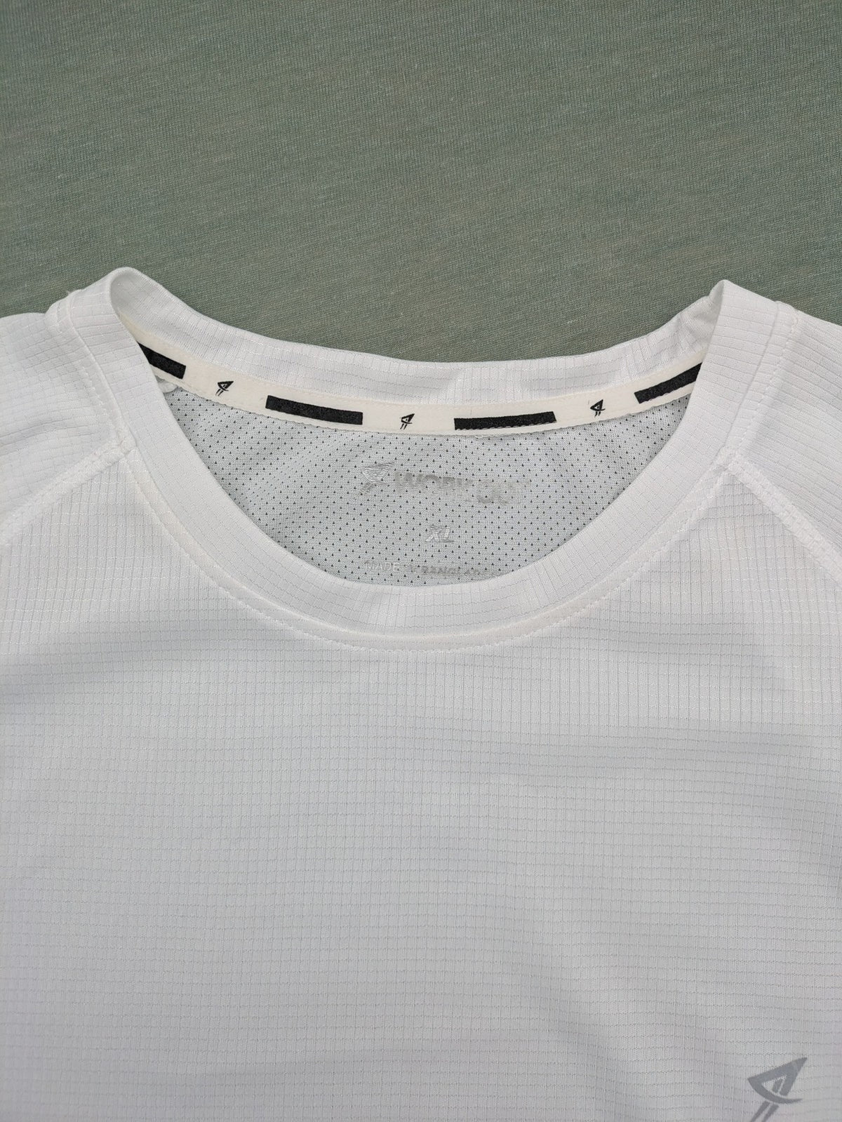 Smilodox white workout t-shirt with logo on chest and reflective detail on back.