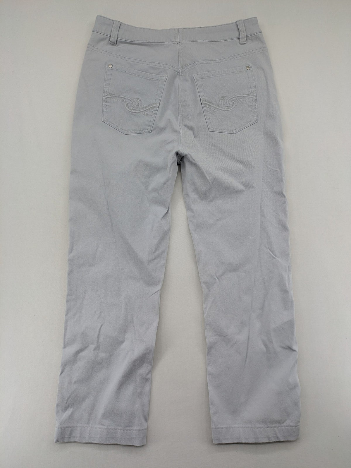 Chino grey capri pants five-pocket design with subtle embroidery and stretch cotton blend.