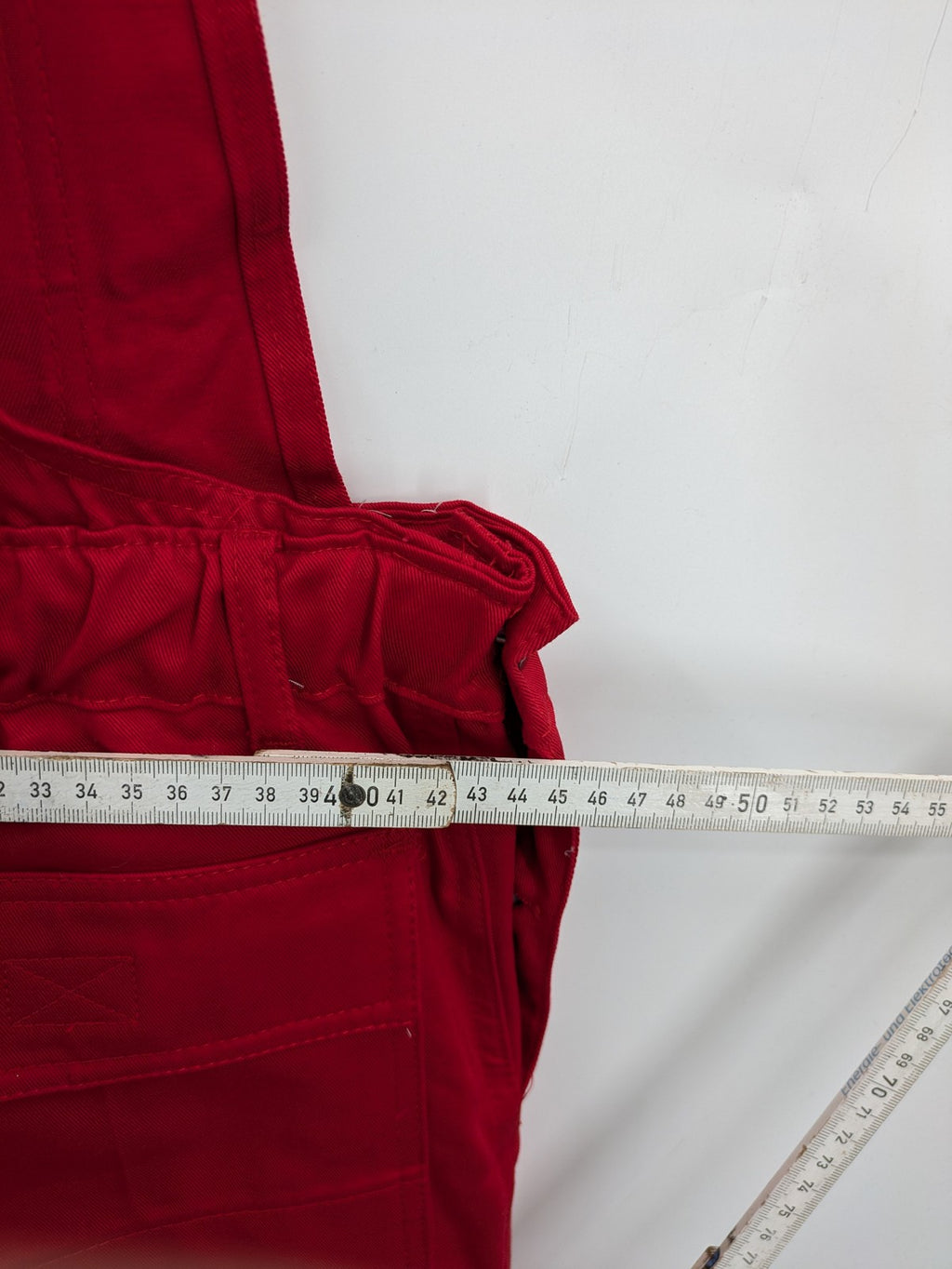 Stonekit red work overalls cotton with adjustable straps and multiple cargo pockets.