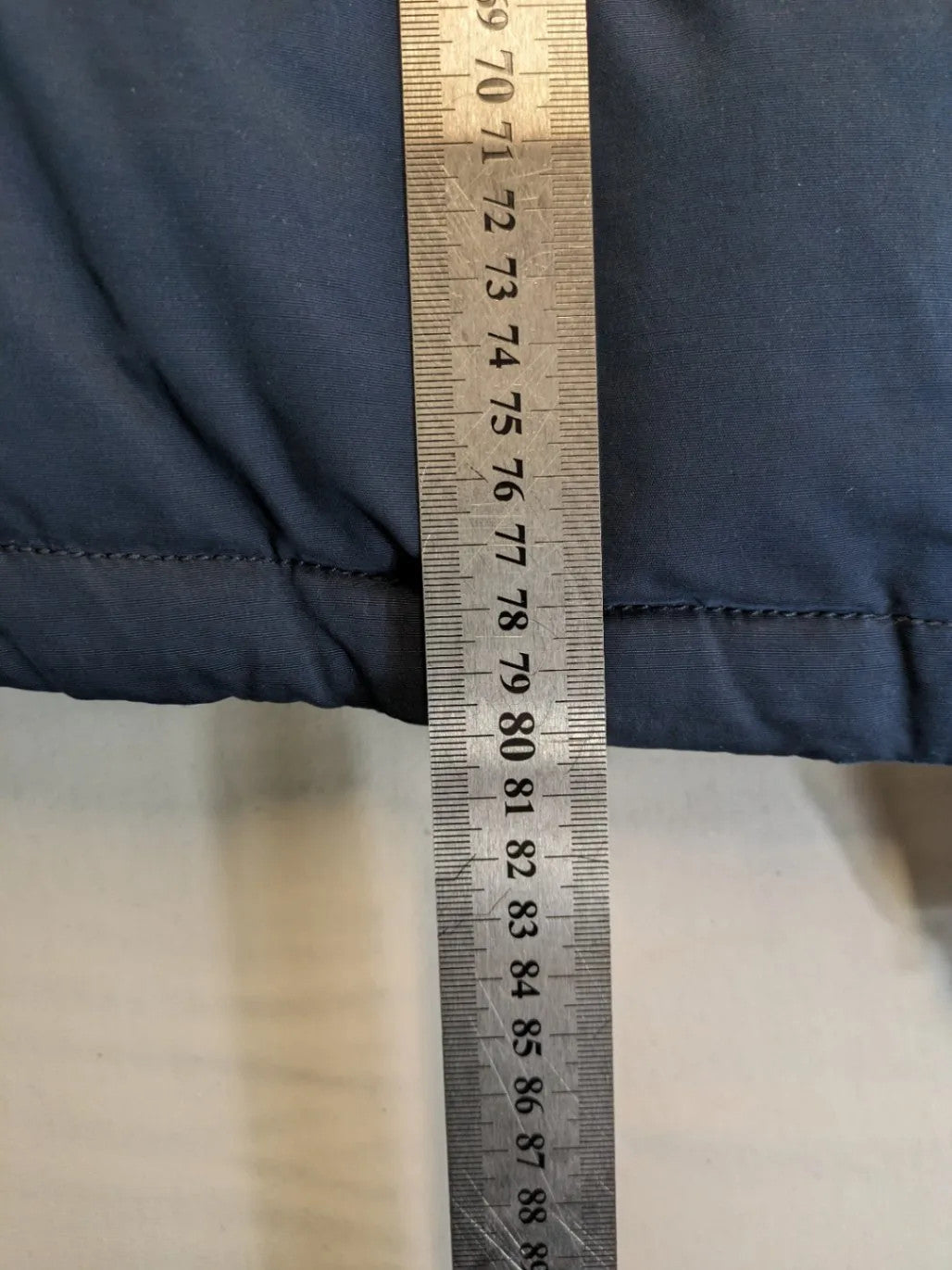 Tommy Hilfiger Denim blue parka coat with faux fur hood and Sherpa lining.