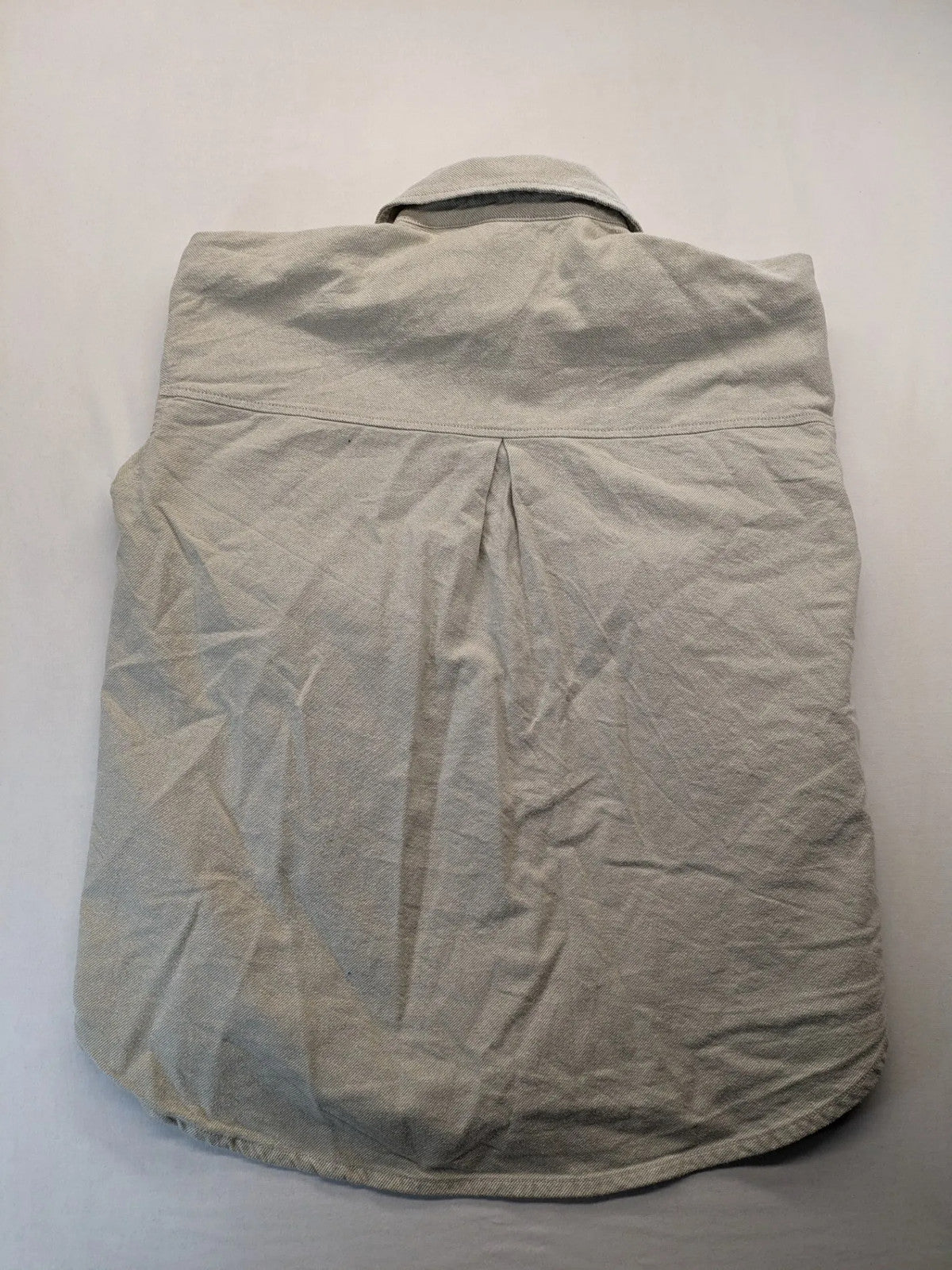 H&M beige overshirt jacket, classic collar, button-down front, two chest pockets, cotton material.