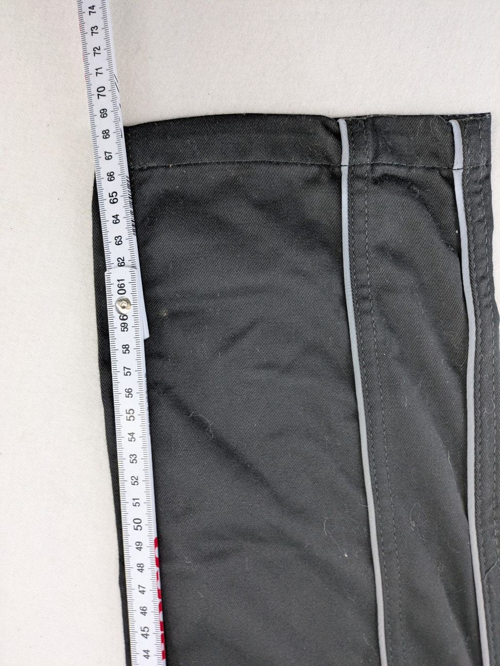 Powerfix Profi blue cargo pants with reflective stripes and side pockets, durable polyester-cotton blend.