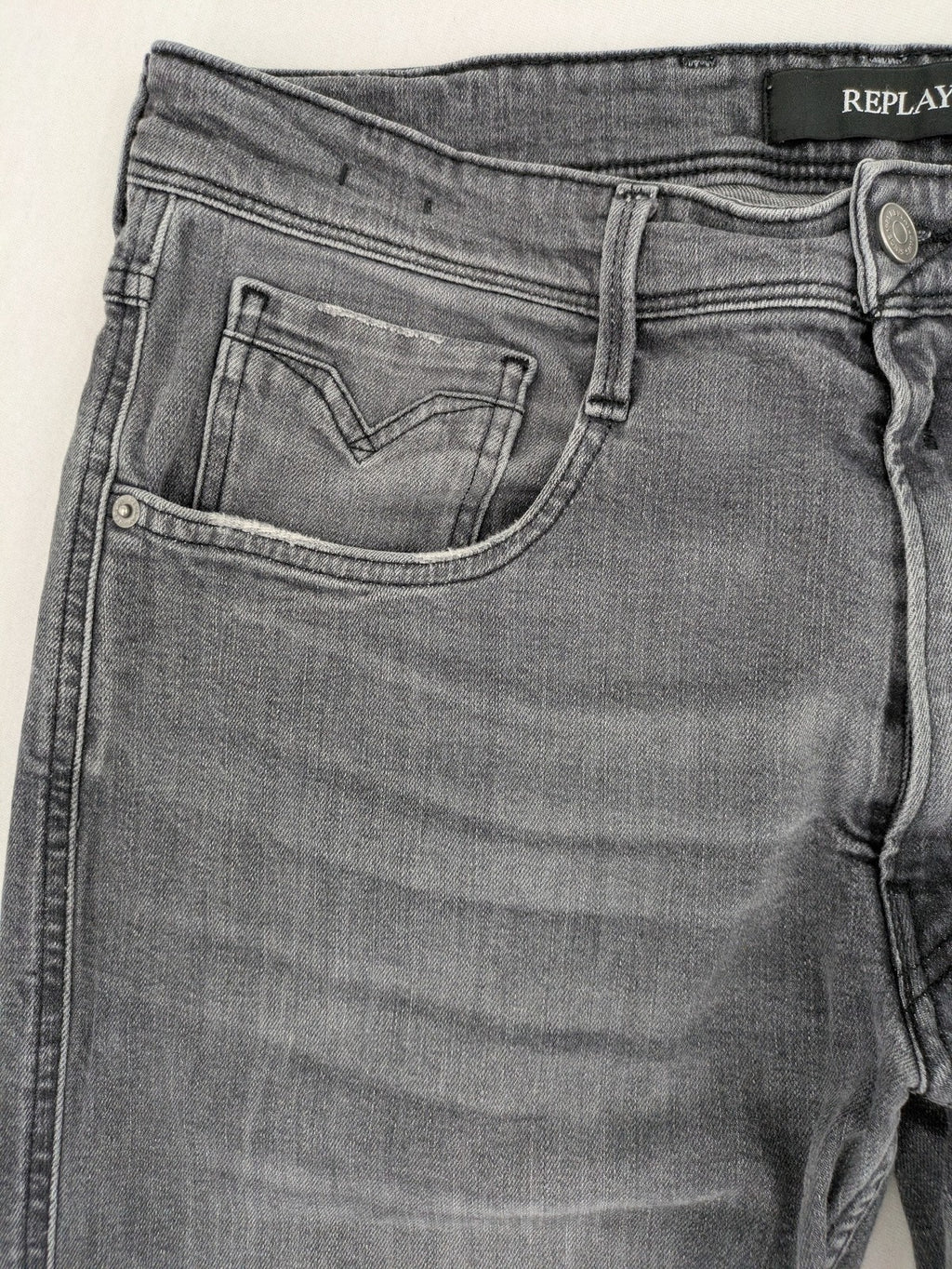 Replay grey straight jeans faded wash five-pocket style with logo on pocket.