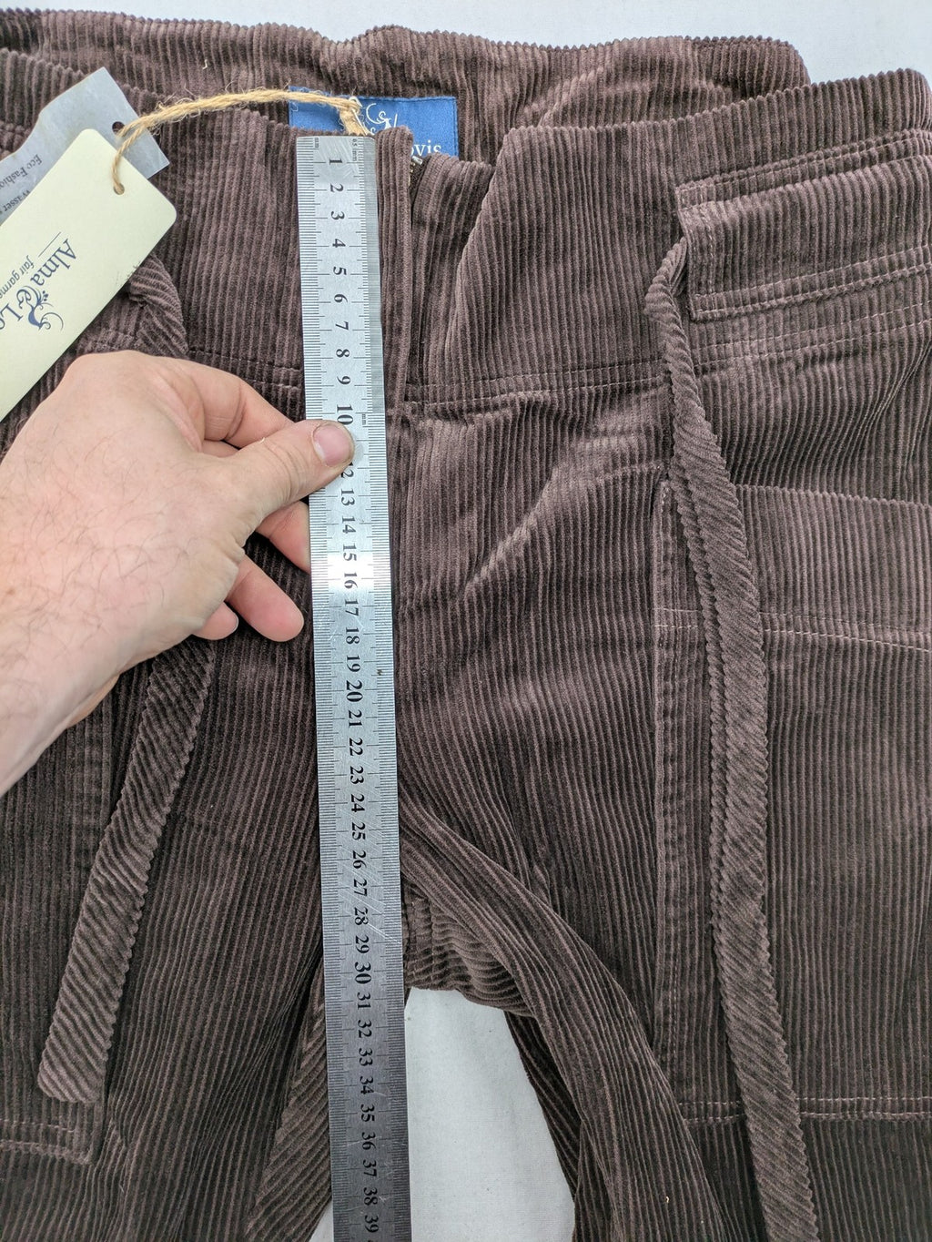 Alma & Lovis brown cord pants with drawstring, casual fit, and patch pockets.