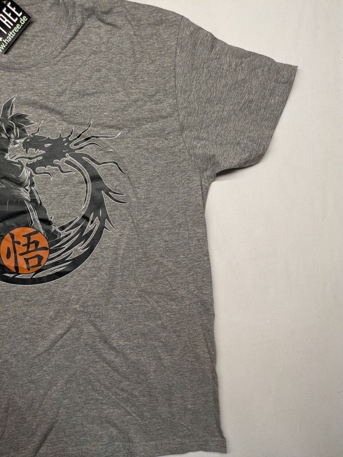Dragon Ball Z grey t-shirt featuring Son Goku graphic print and "Go" Kanji symbol.