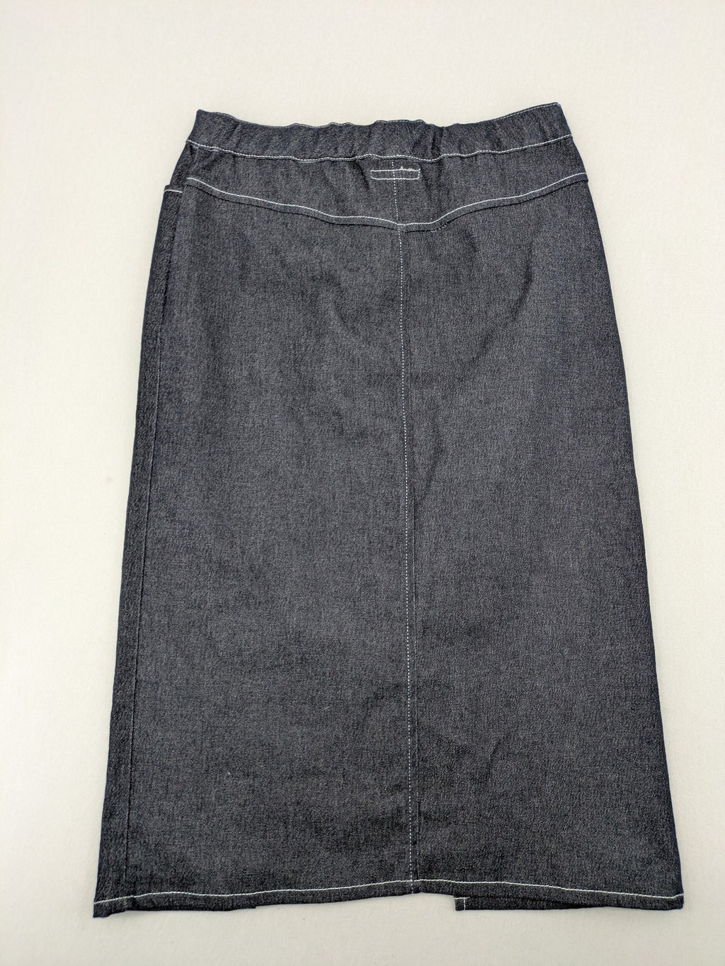 Extyn blue midi skirt with rhinestone dragonfly detail and front slit, stretchy denim fabric.