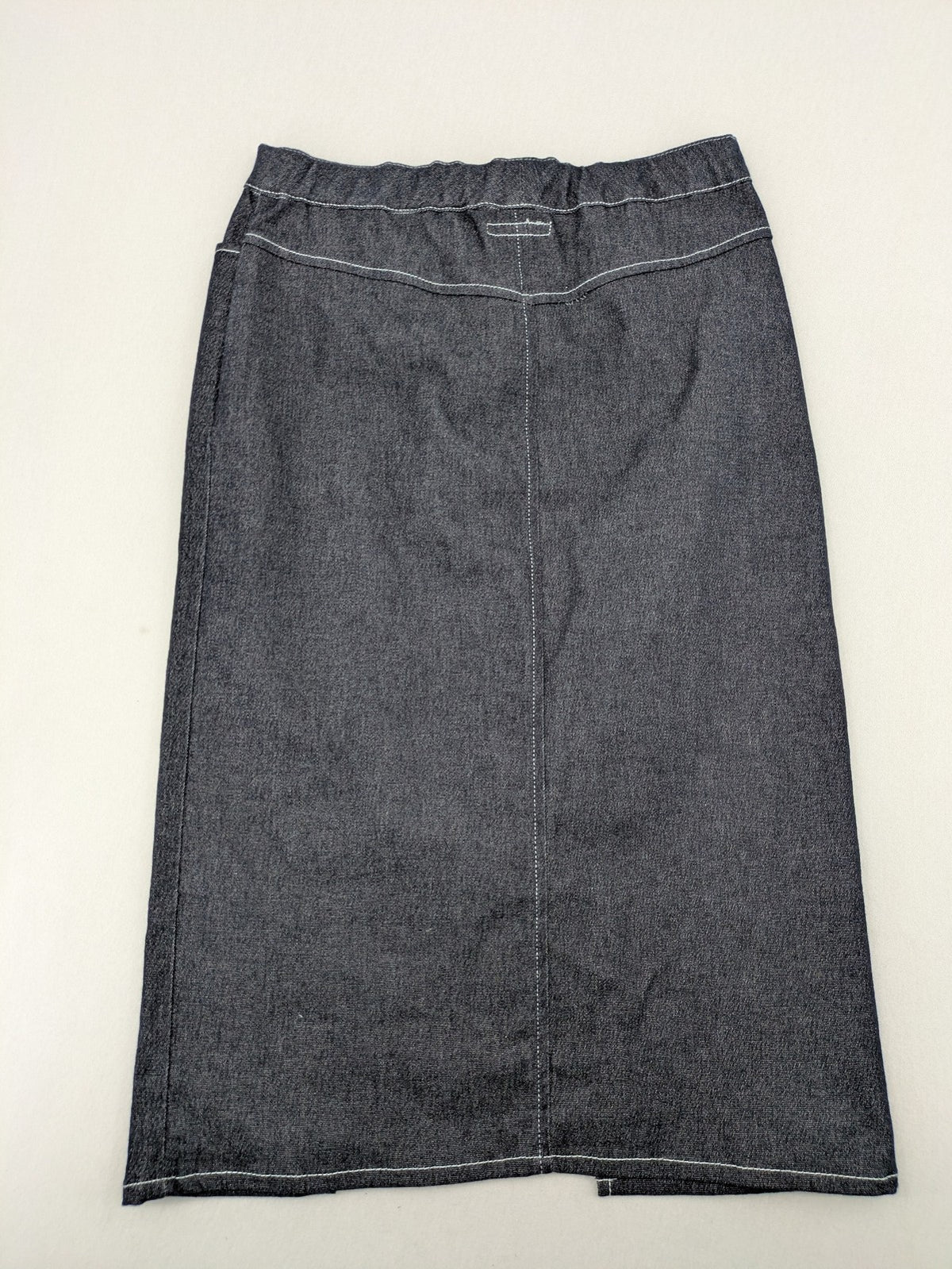 Extyn blue midi skirt with rhinestone dragonfly detail and front slit, stretchy denim fabric.