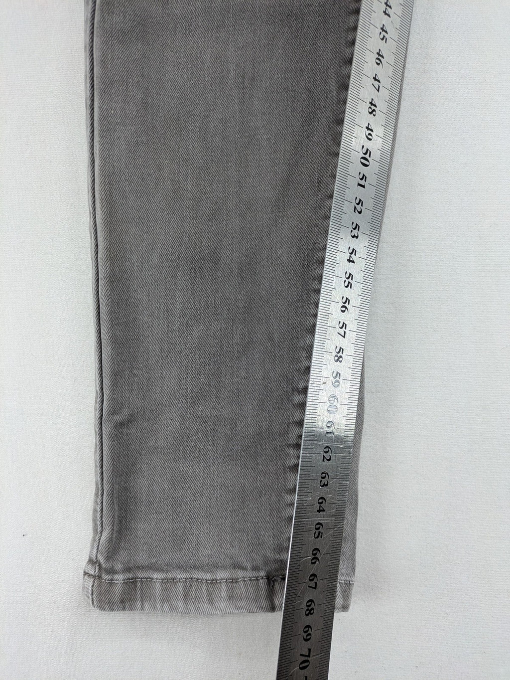 Made in Italy grey biker jeans with zip pockets and structured knee detailing.