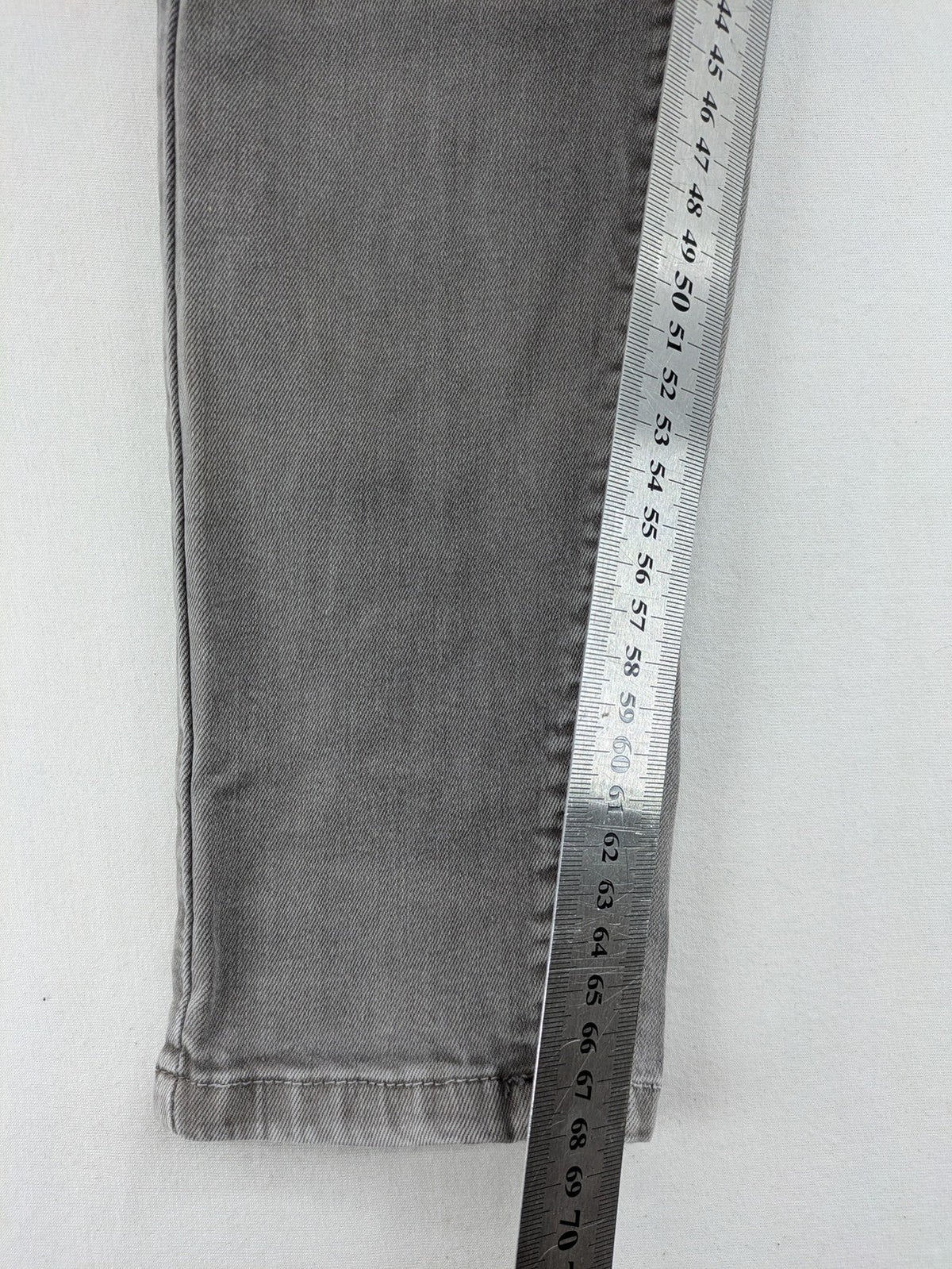 Made in Italy grey biker jeans with zip pockets and structured knee detailing.