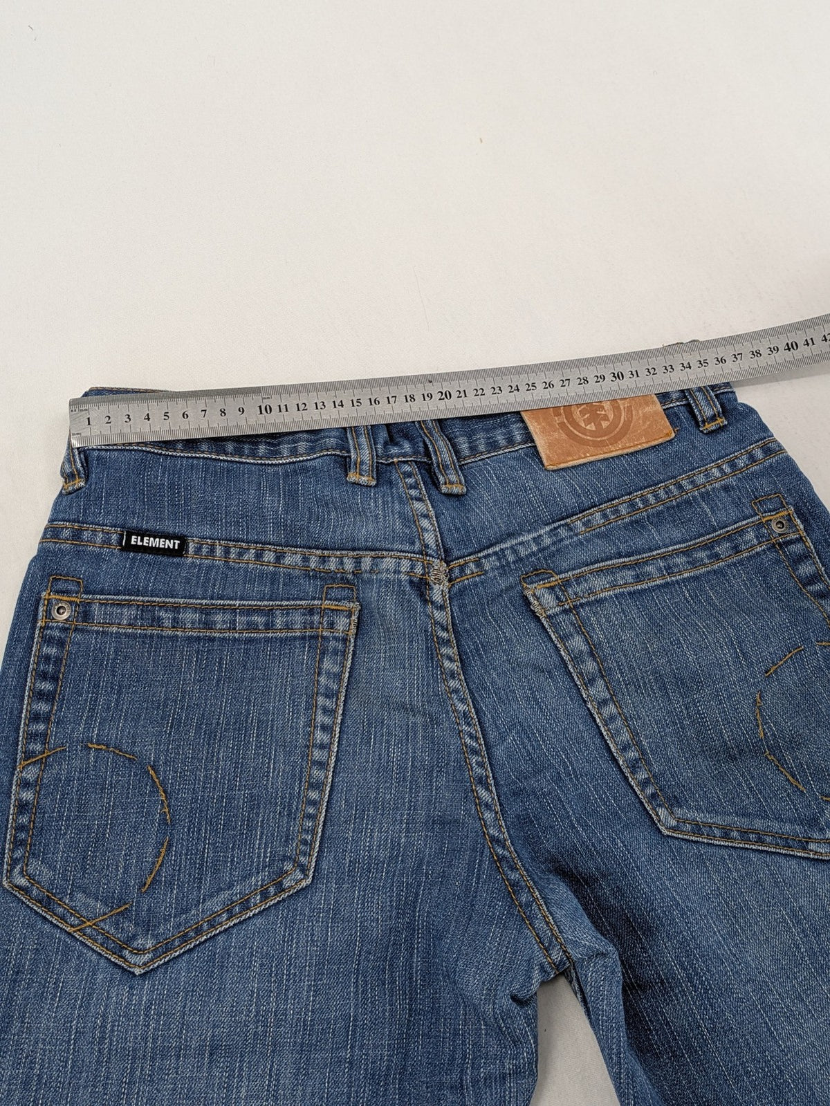 Element blue straight jeans with classic button fly and 5-pocket design.