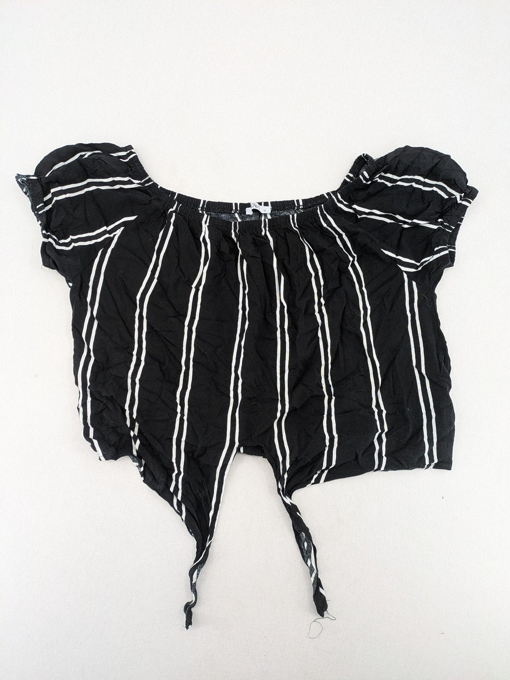 Hailys black and white striped crop top with front tie and off-shoulder design.